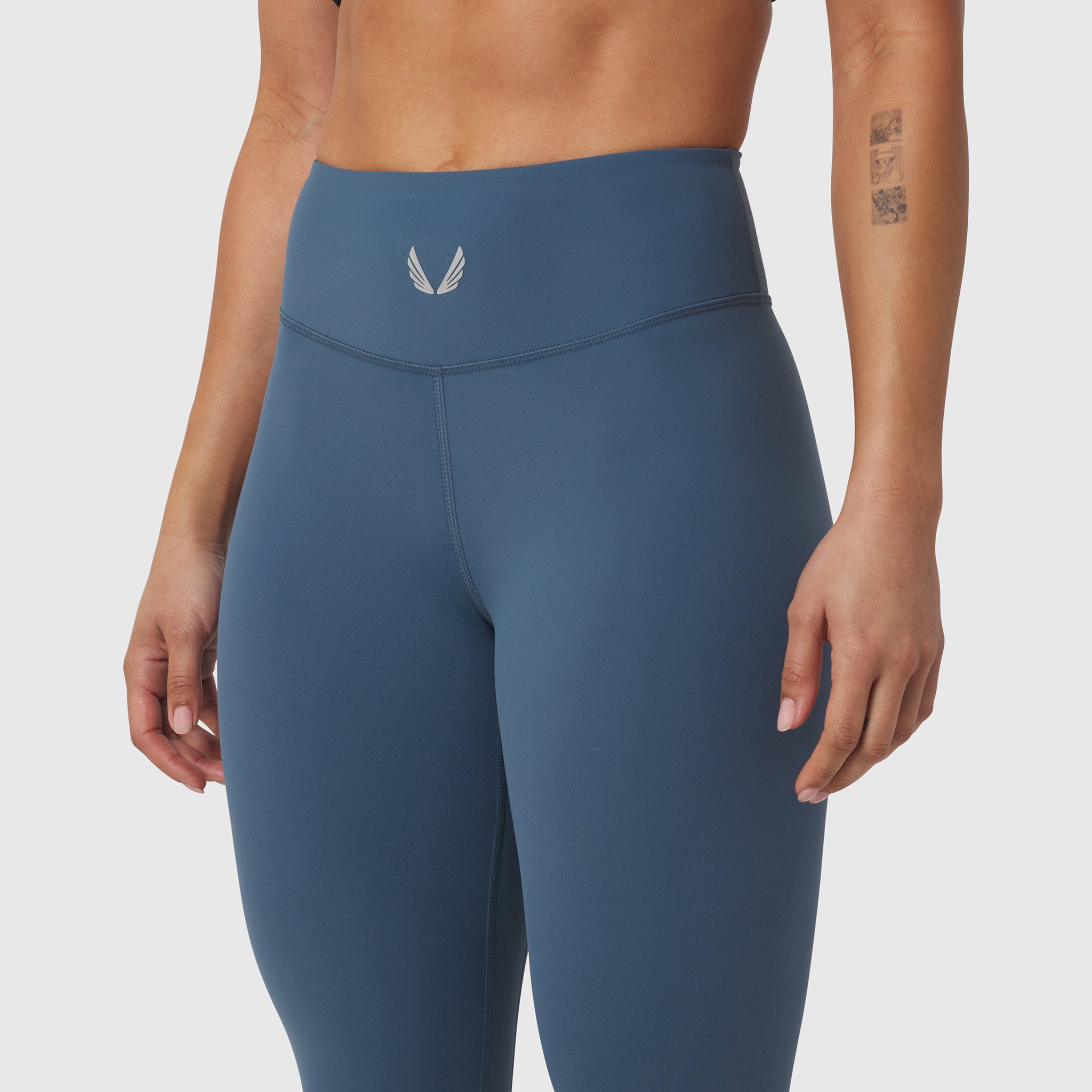 W002 LYCRA® ADAPTIV Legging in storm blue, modeled from waist down