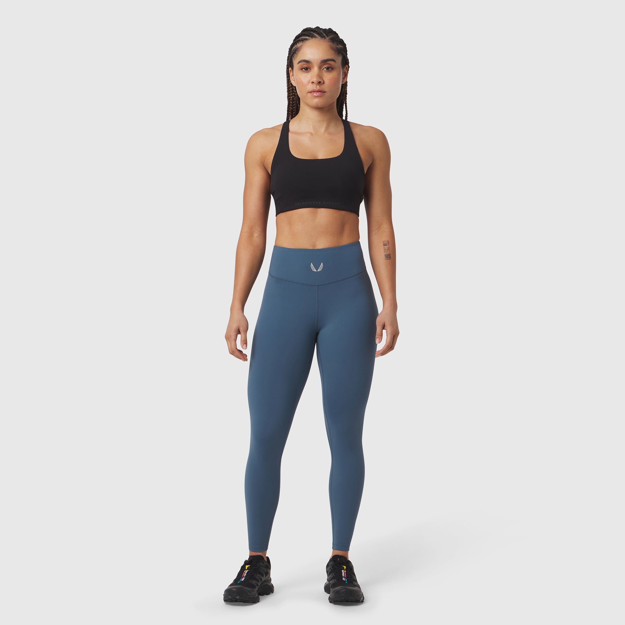 W002 LYCRA® ADAPTIV Legging in storm blue, worn by model standing facing camera
