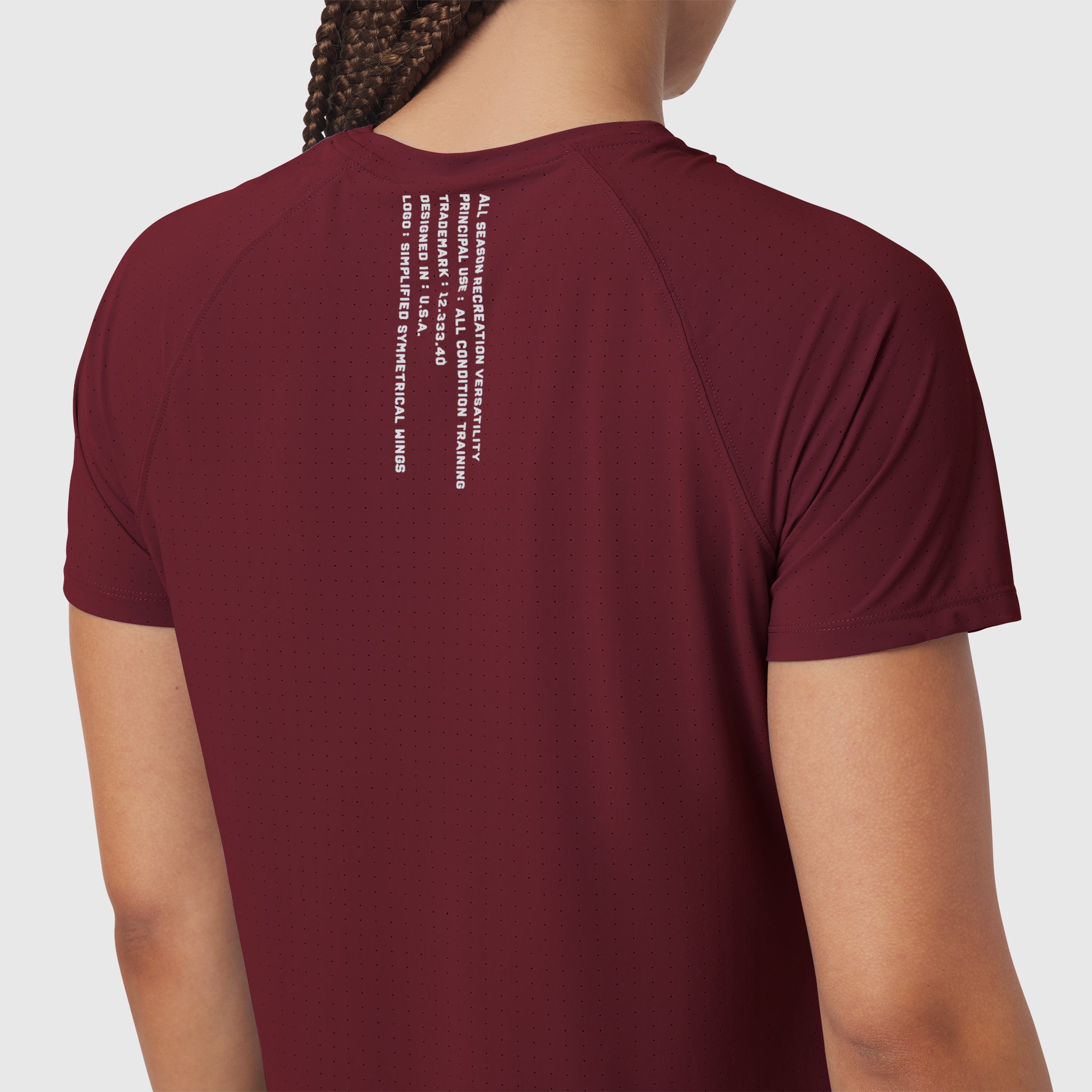 Crimson Laser-Vent Established Tee worn by model, back view showing white text graphic