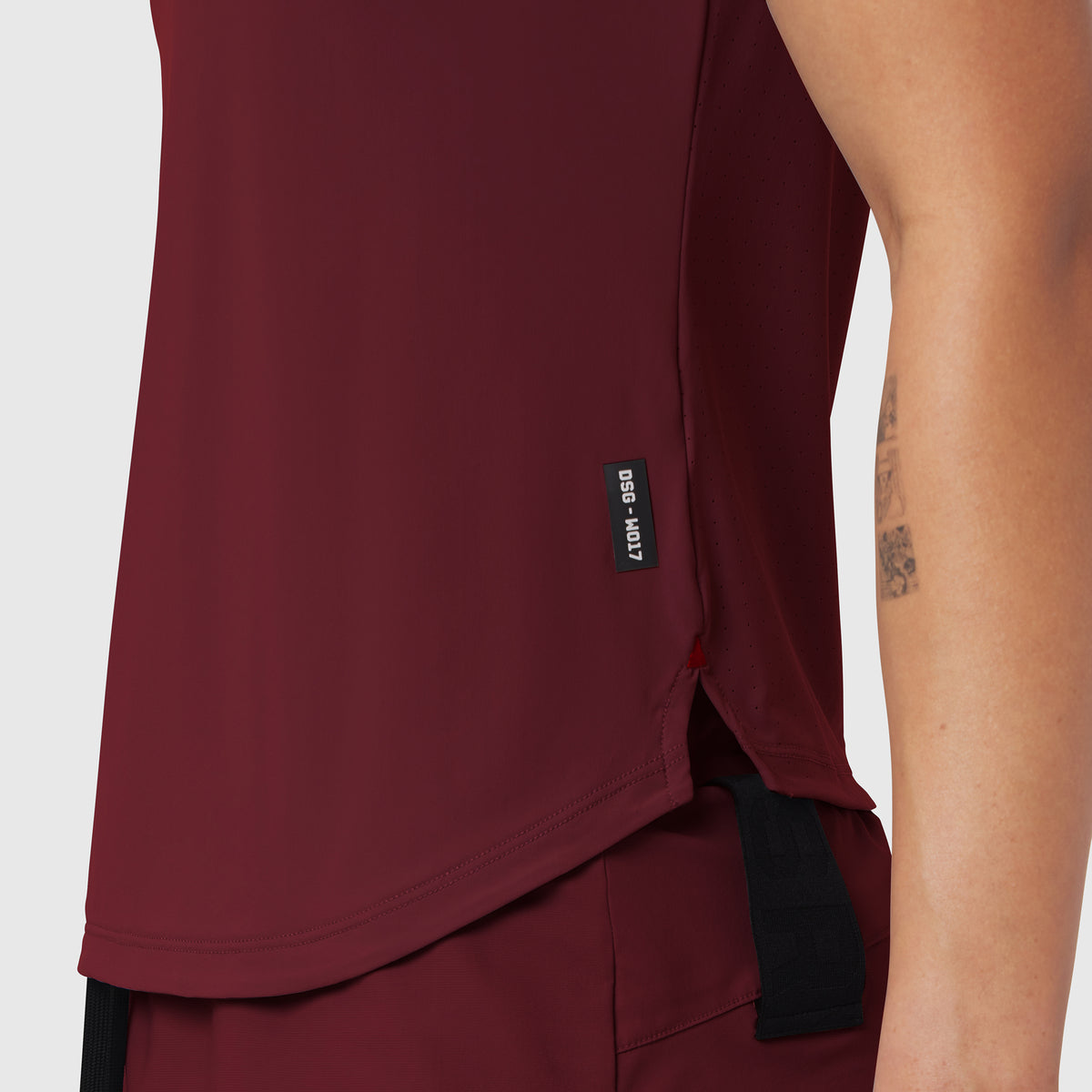 Laser-Vent Established Tee in crimson worn by model, side view detail
