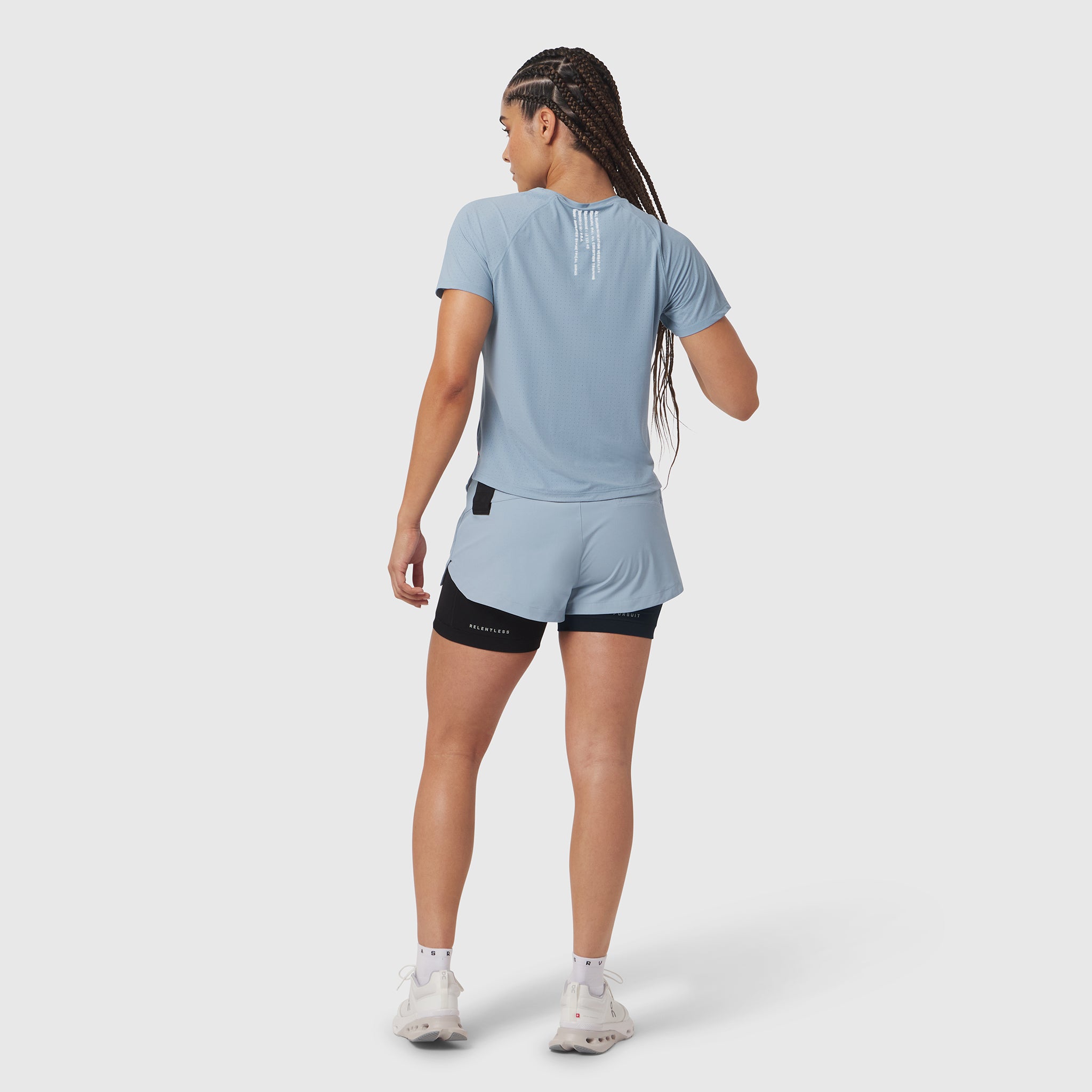 Laser-Vent Established Tee in light sky, worn by model from behind while running