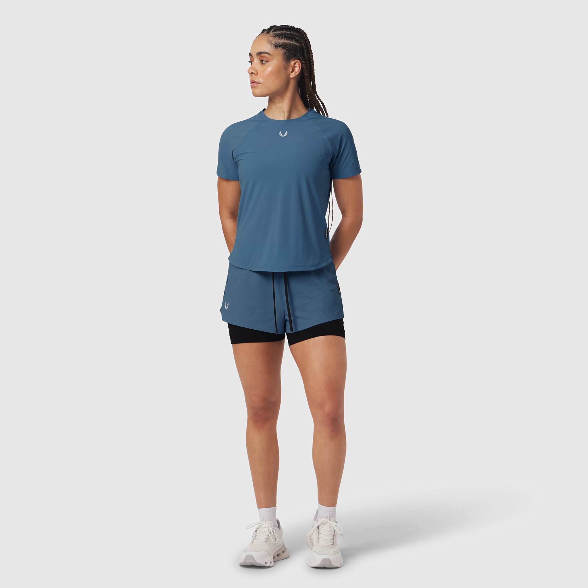 W017. Laser-Vent™ Established Tee in storm blue worn with matching shorts, front view