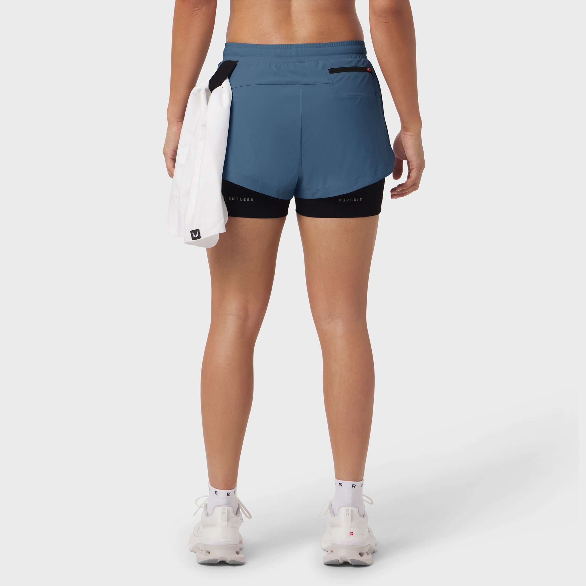 W025 Tetra-Lite Liner Short in storm blue with black liner, back view on model