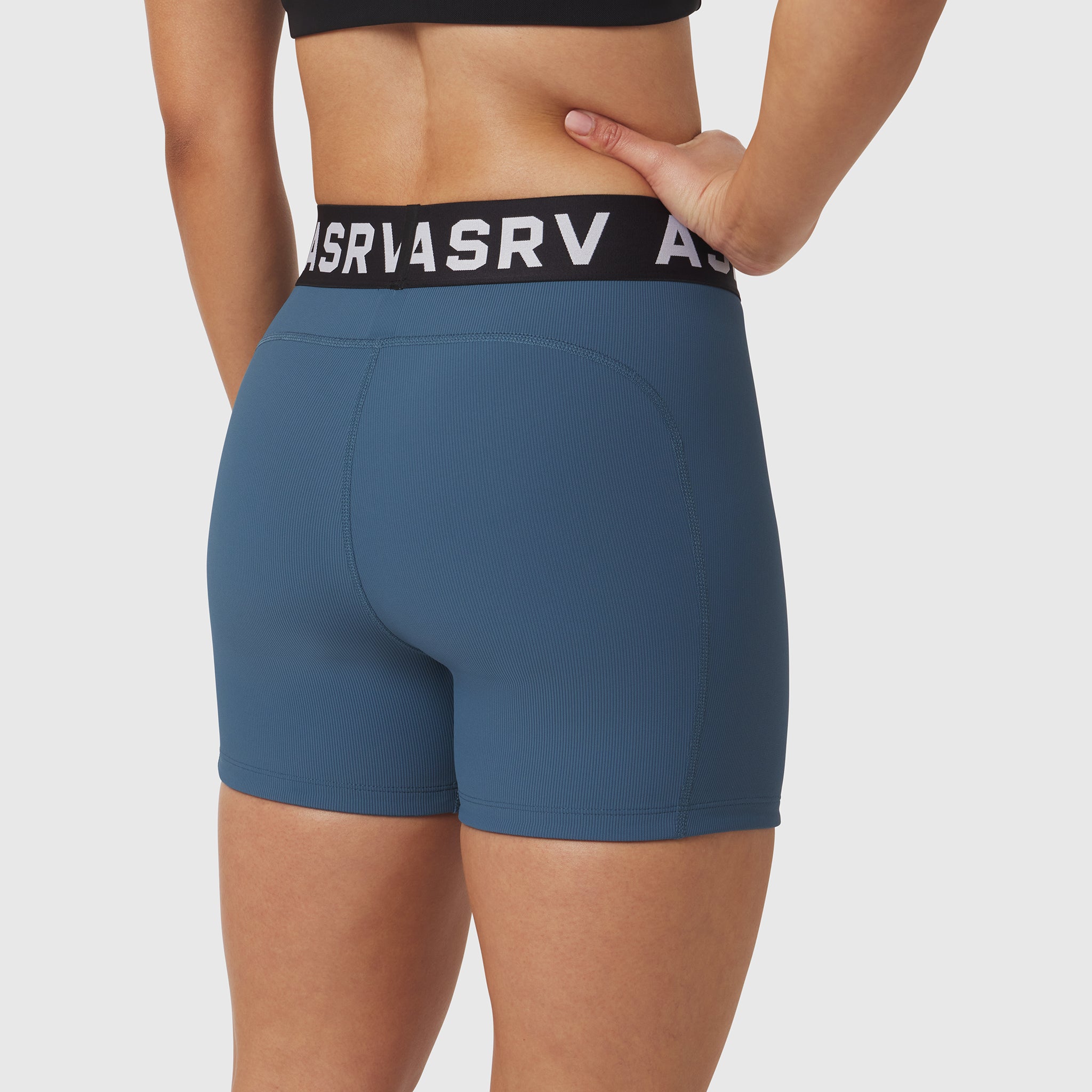 W027 Lycra Ribbed Short in storm blue, worn by model showing back view