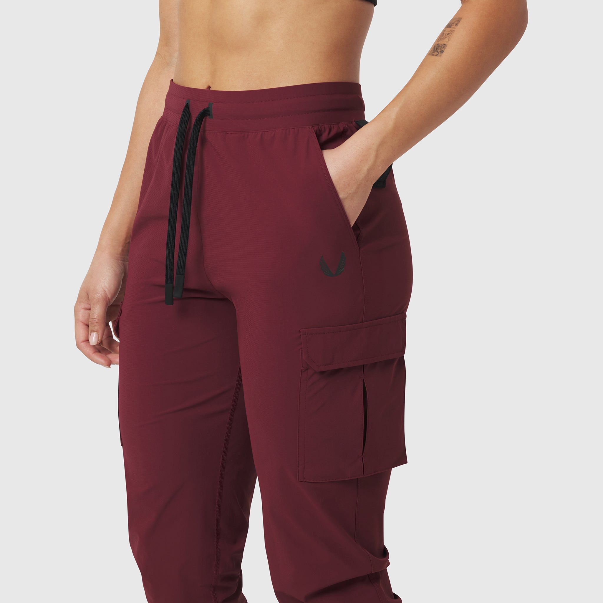 Tetra-Lite Cargo High Rib Jogger in crimson, worn by model, side view