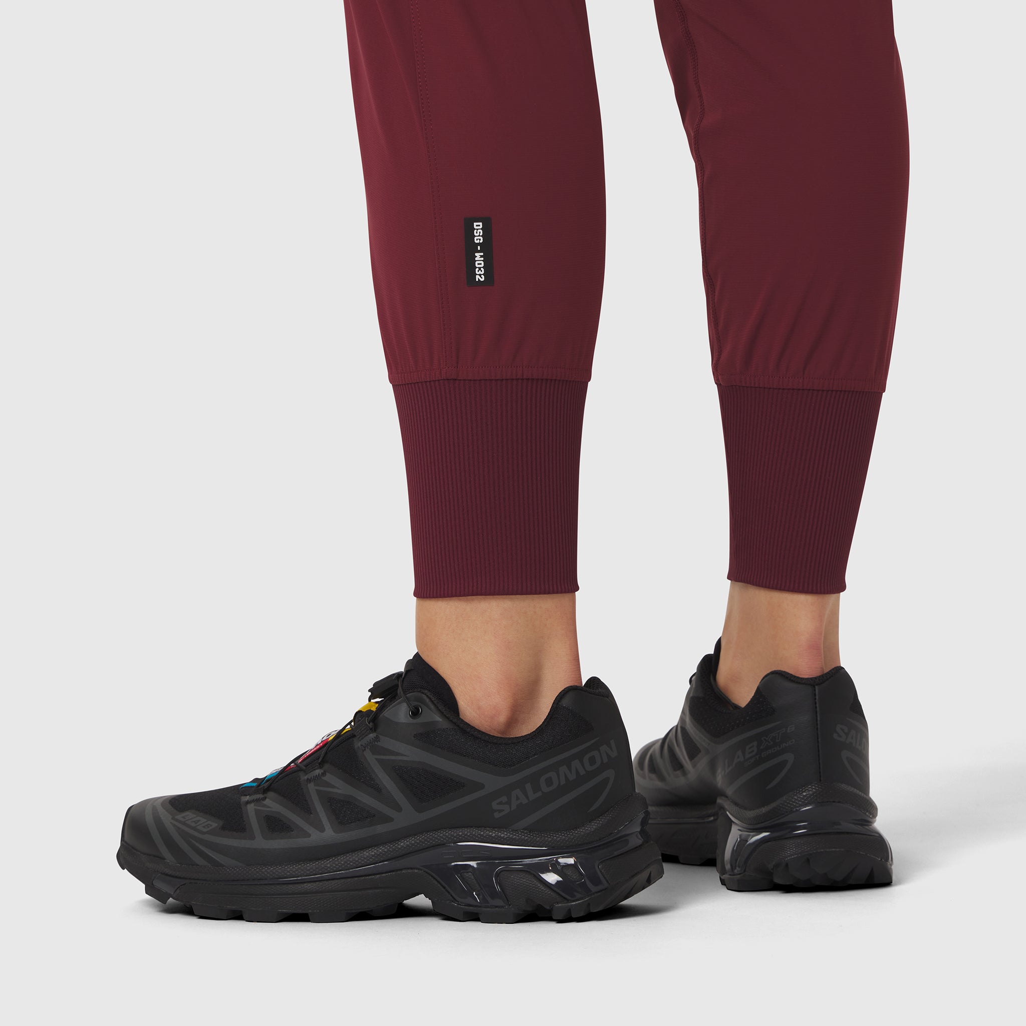 Tetra-Lite Cargo High Rib Jogger in Crimson worn with black sneakers, front view