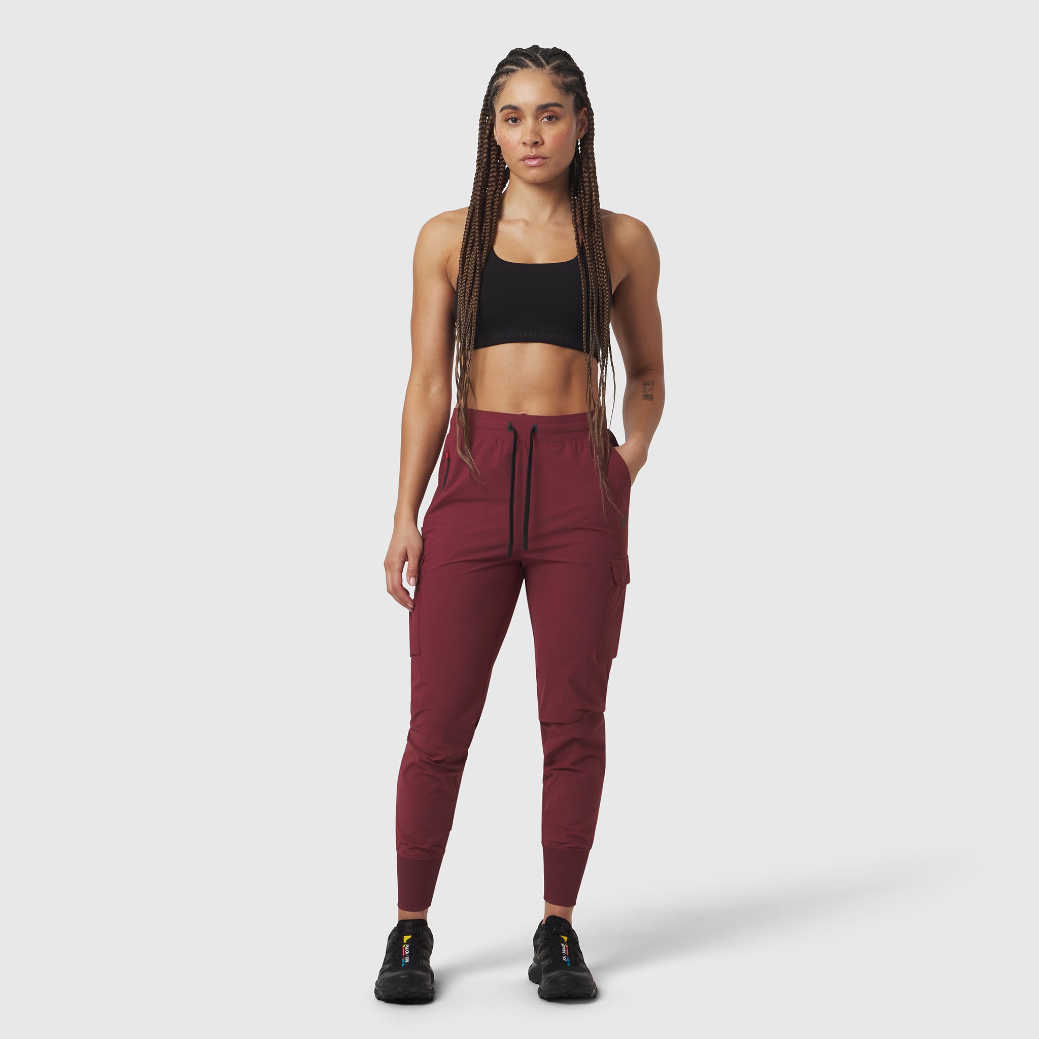 Tetra-Lite® Cargo High Rib Jogger in crimson, worn with black sports bra, front view