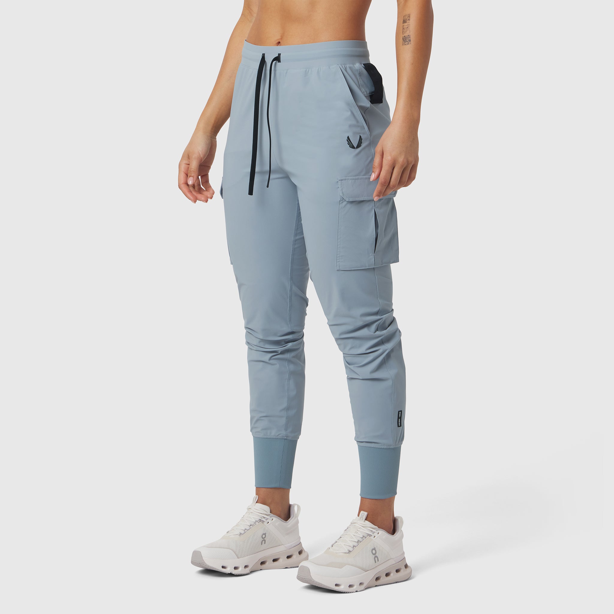 Tetra-Lite Cargo High Rib Jogger in Light Sky, worn by model with white sneakers