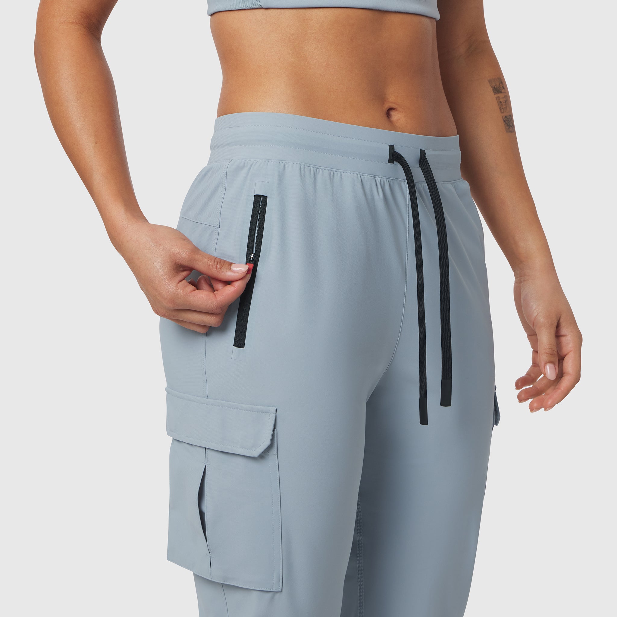 Tetra-Lite Cargo High Rib Jogger in Light Sky, model wearing, side view
