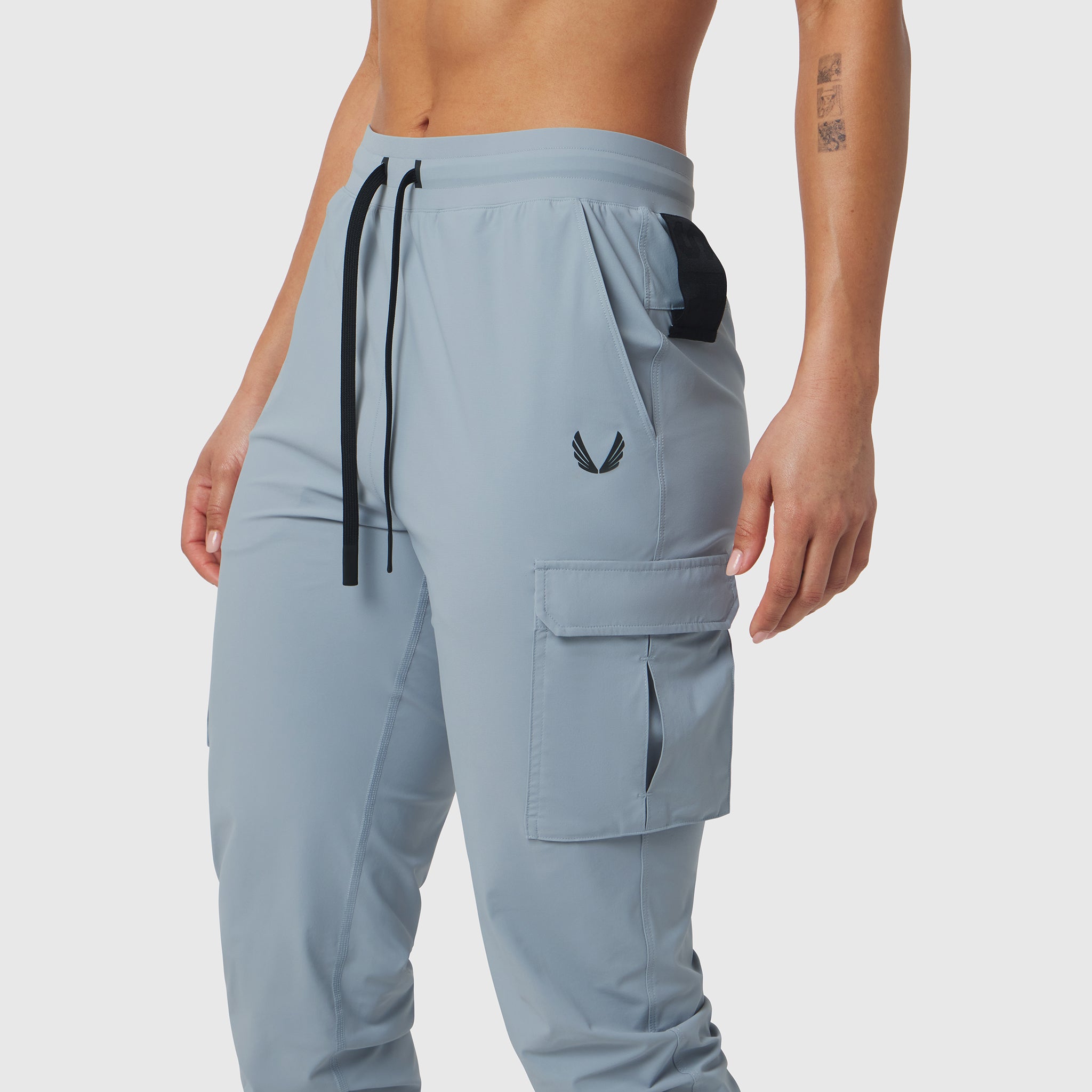 Tetra-Lite Cargo High Rib Jogger in light sky, worn by model, side view