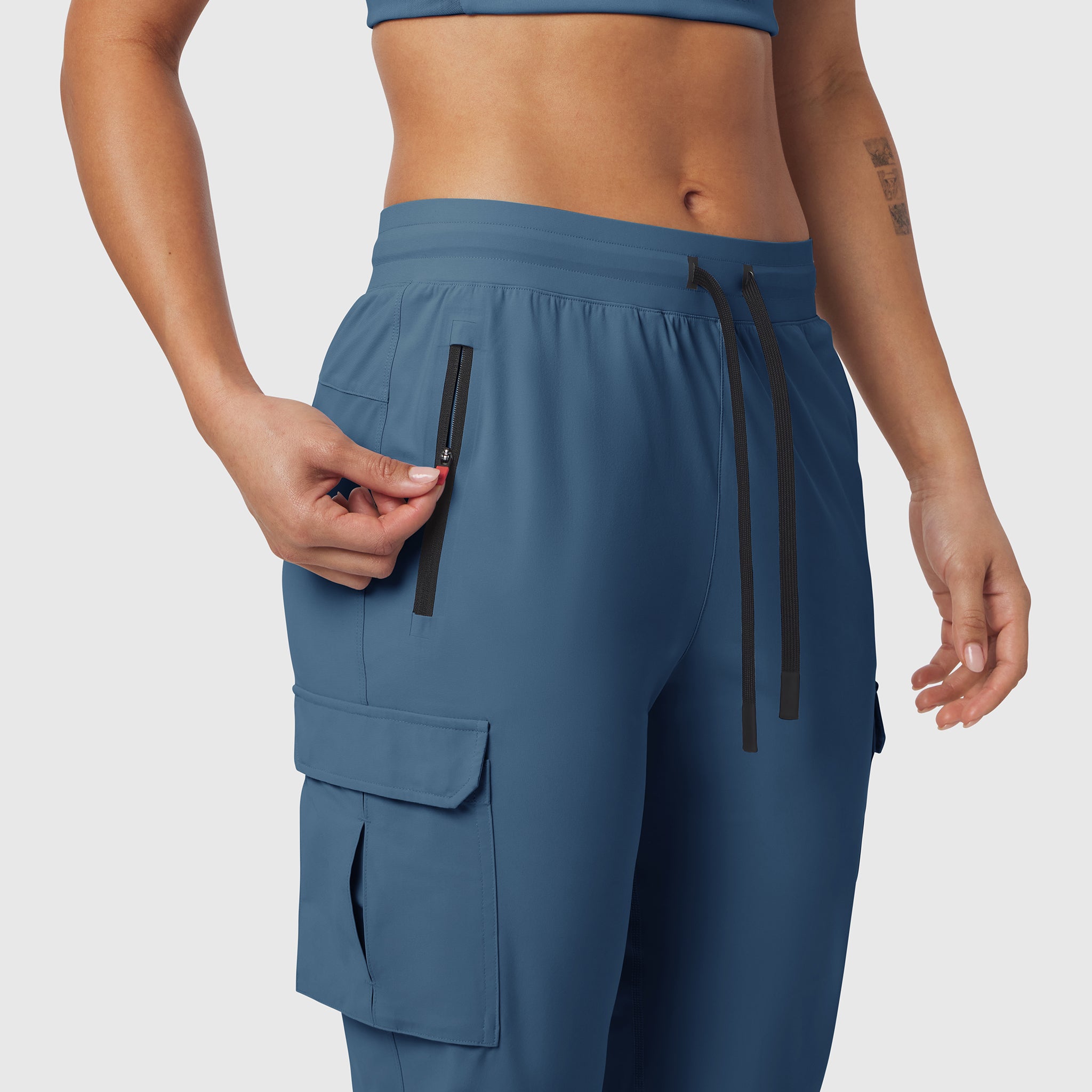 Tetra-Lite Cargo High Rib Jogger in Storm blue, worn by model showing side pocket detail