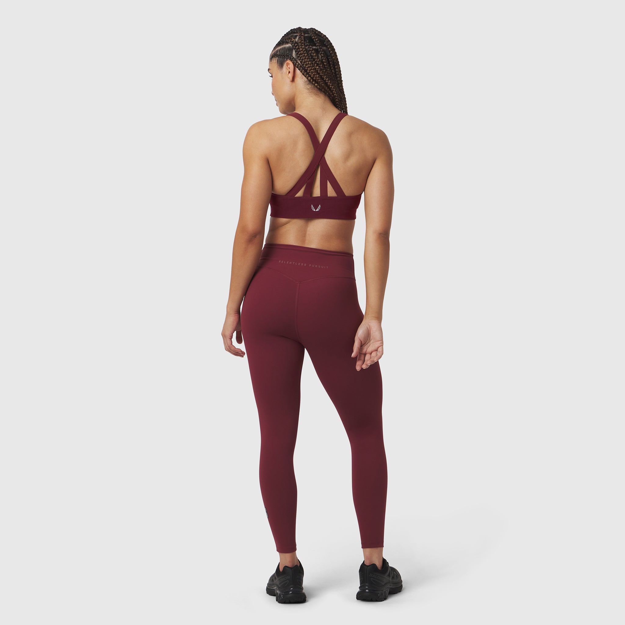Crimson LYCRA® Hybrid Sports Bra worn by model, back view showing strappy design
