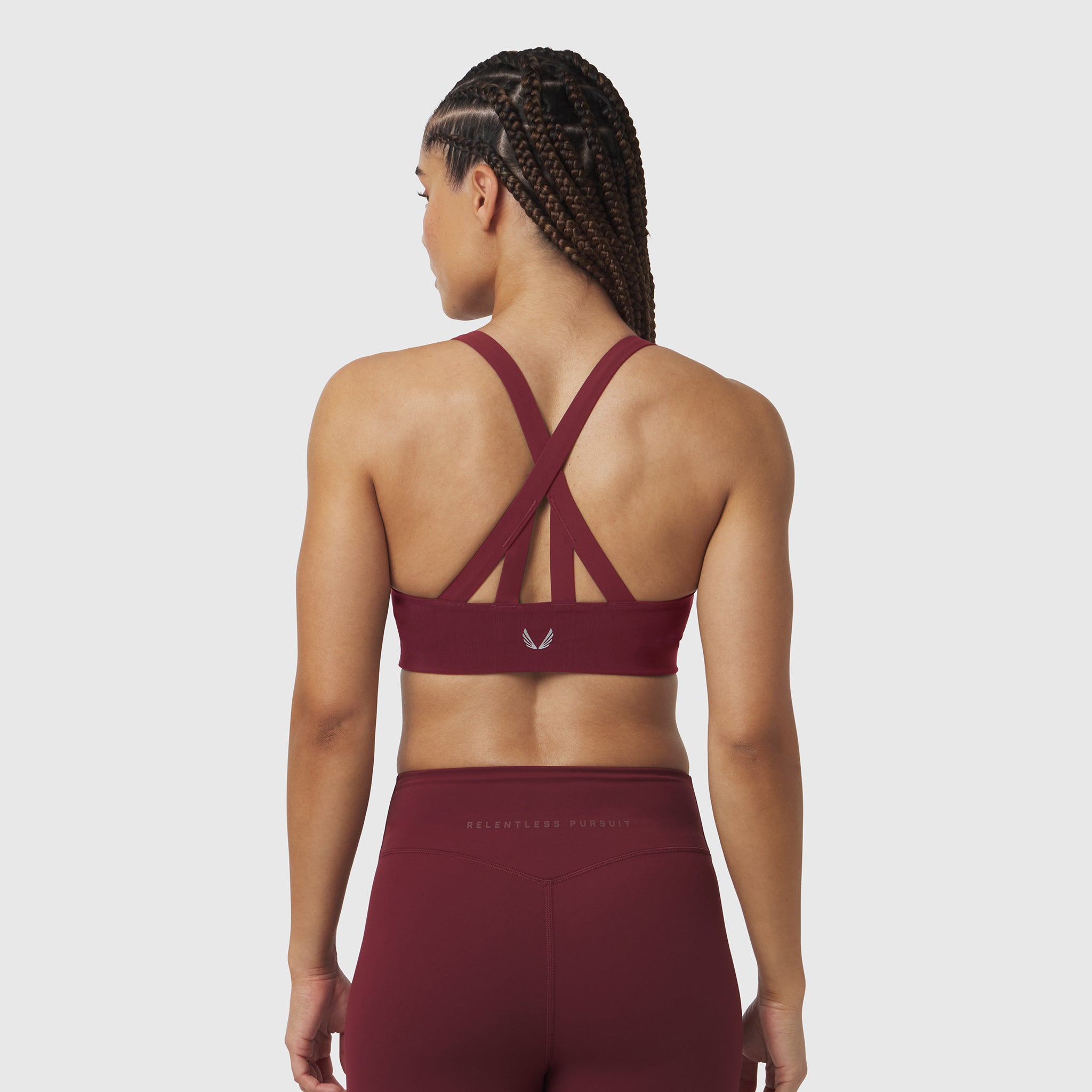 W039 Lycra Hybrid Sports Bra in crimson, back view on model