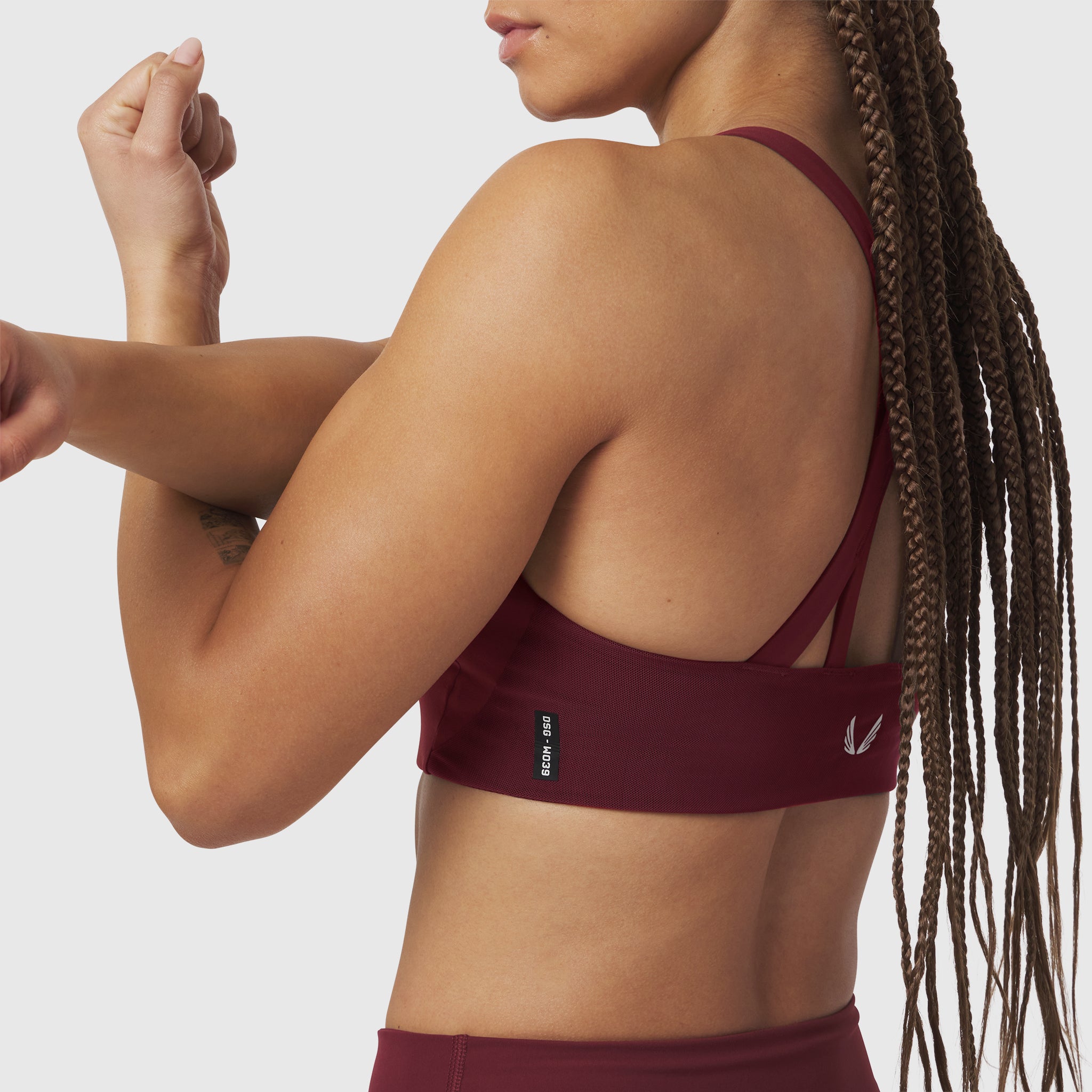 Crimson LYCRA® Hybrid Sports Bra worn by model, back view showing support and fit