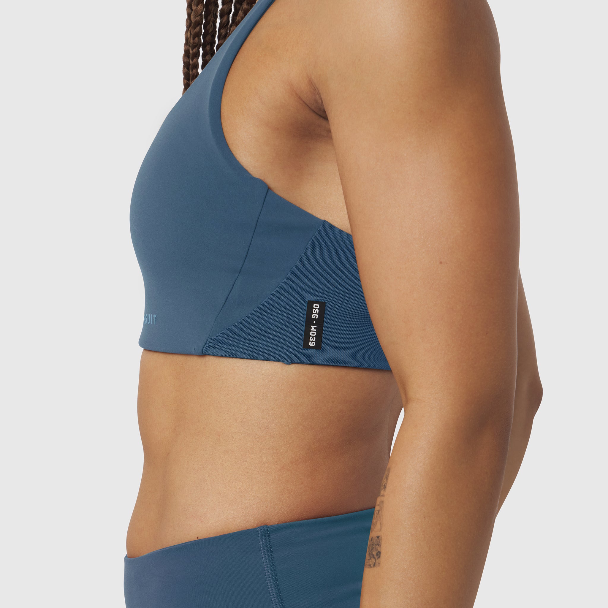 W039 Lycra Hybrid Sports Bra in storm blue, side view on model