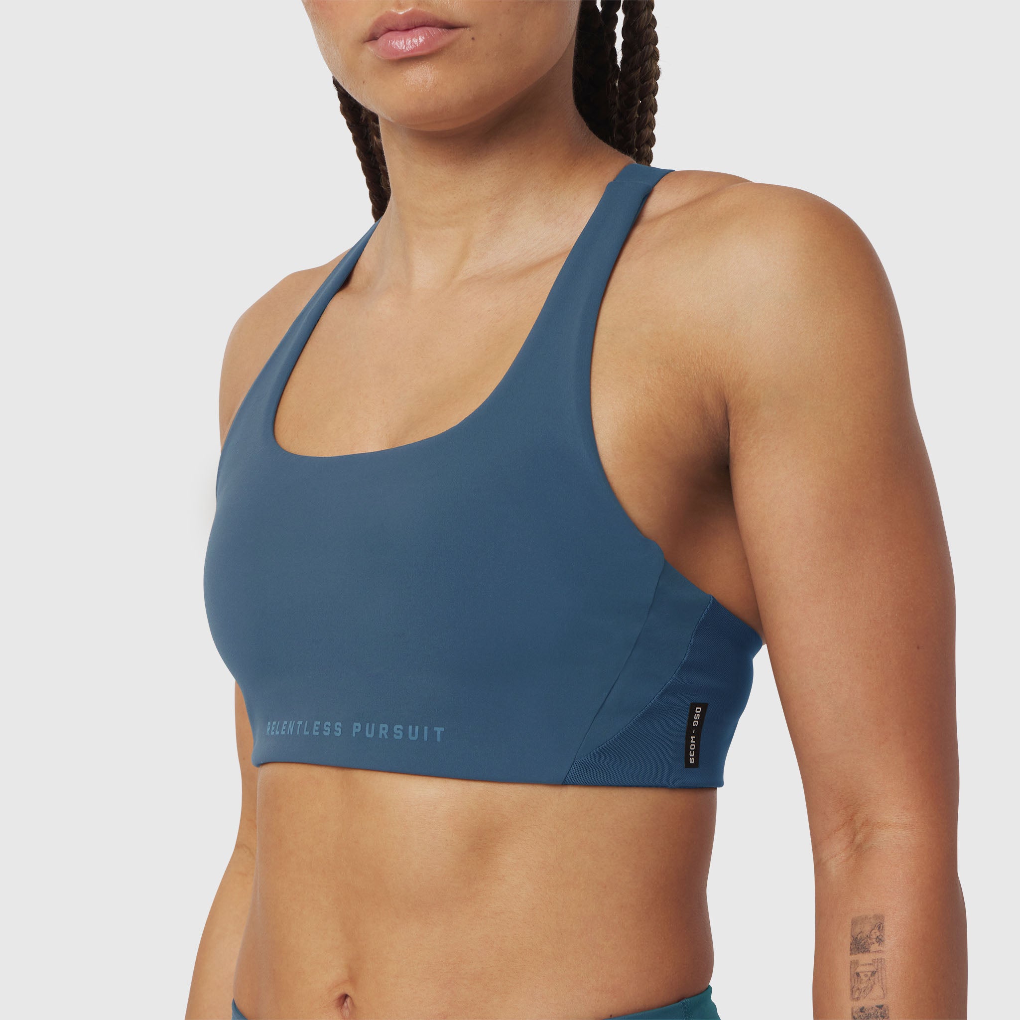 W039 Lycra Hybrid Sports Bra in storm blue, worn by model, front view