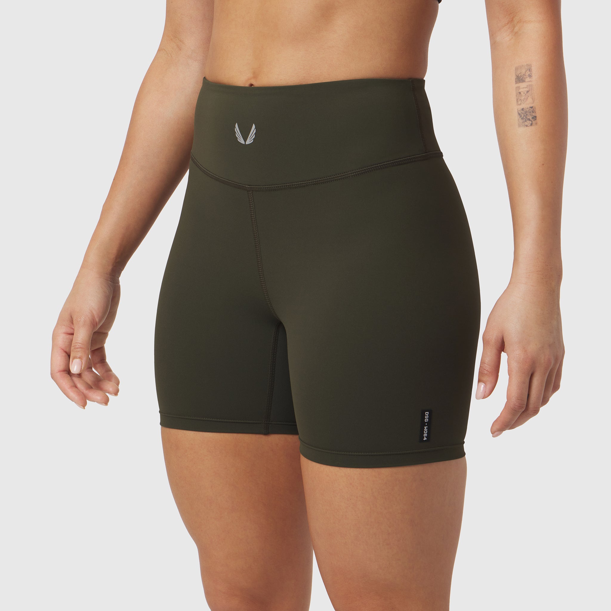 W064 LYCRA® ADAPTIV Biker Short in olive, worn by model, front view