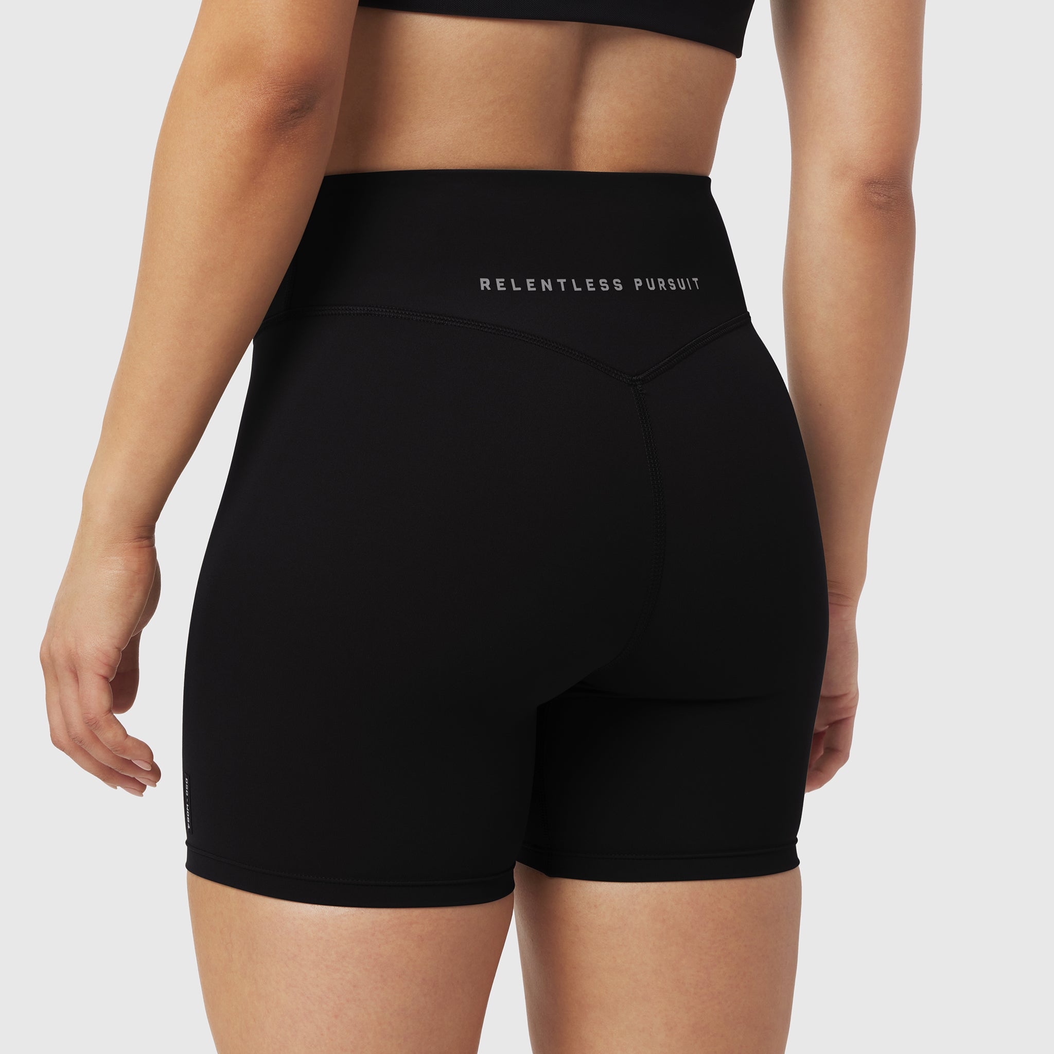 Black LYCRA® ADAPTIV Biker Short on model, back view