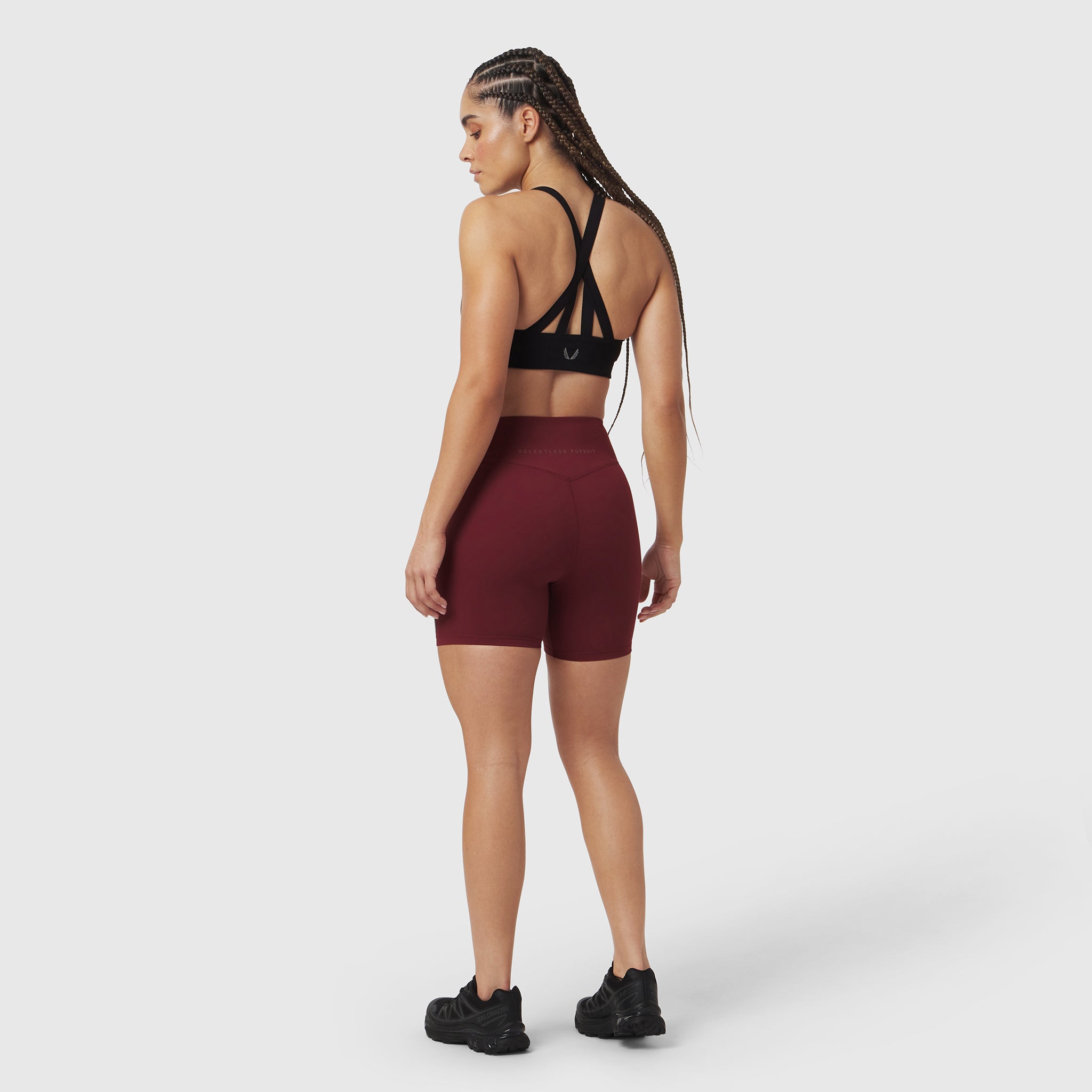 LYCRA® ADAPTIV Biker Short in Crimson, worn by model in back view