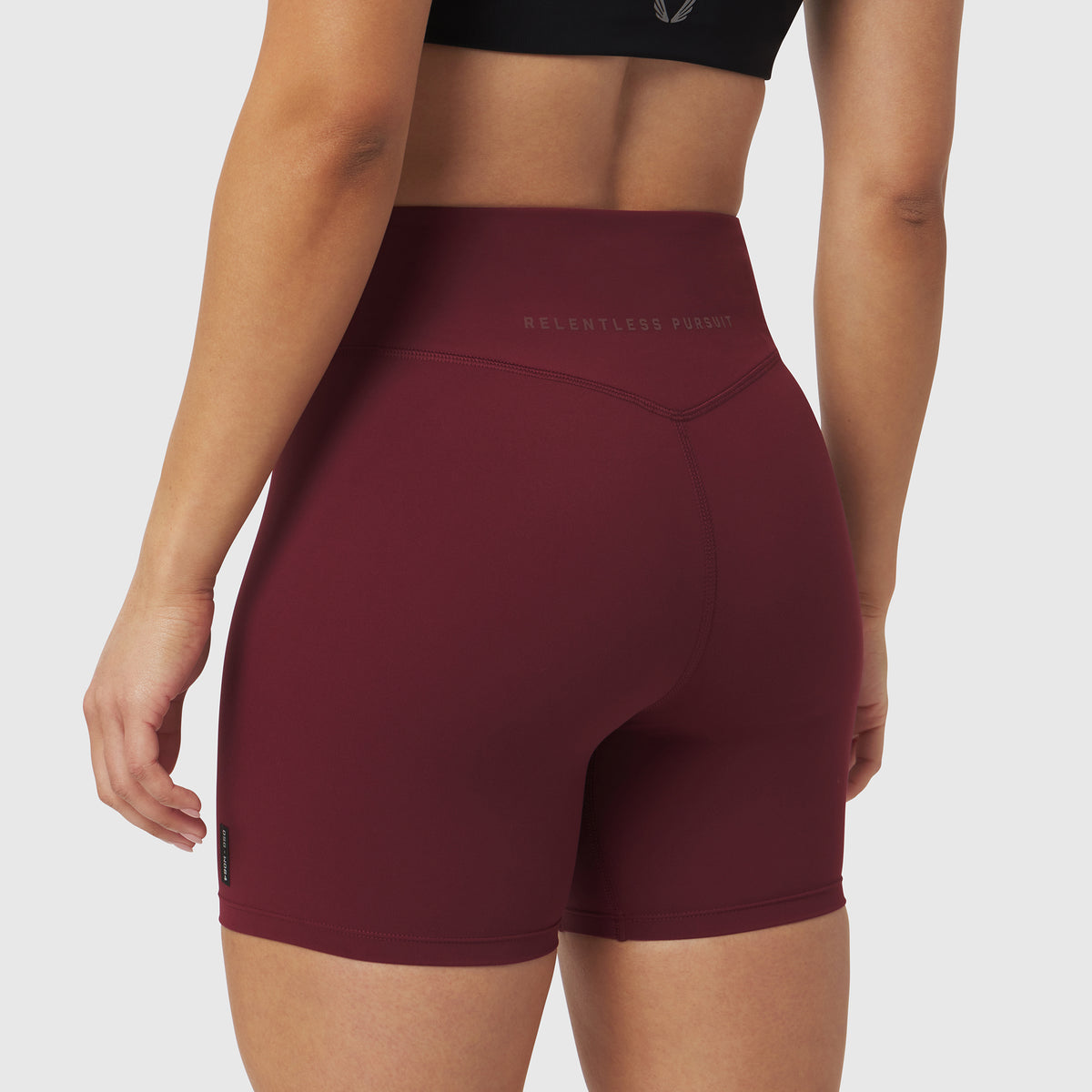 W064 LYCRA® ADAPTIV Biker Short in crimson, back view on model