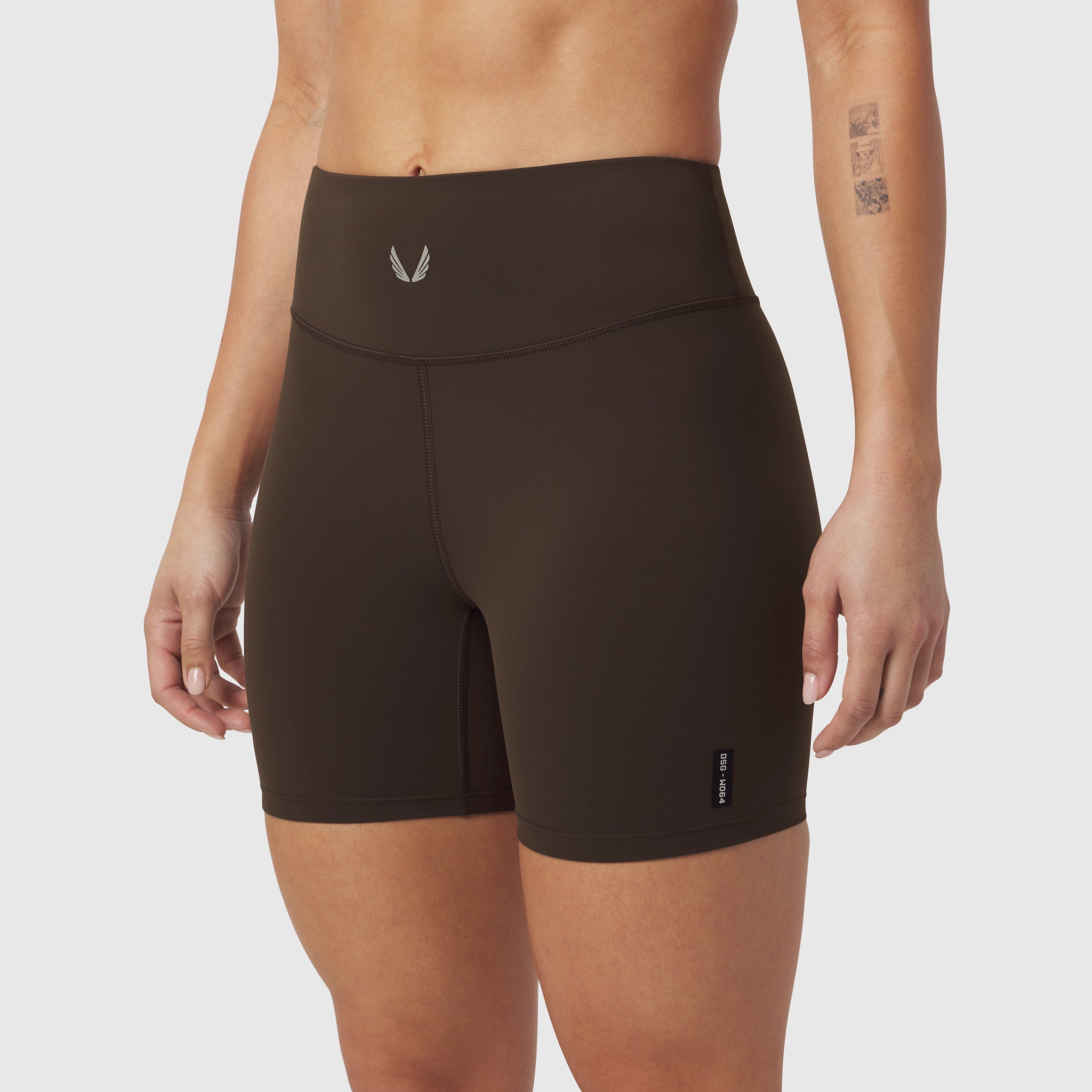 LYCRA® ADAPTIV Biker Short in dark earth worn by model, front view