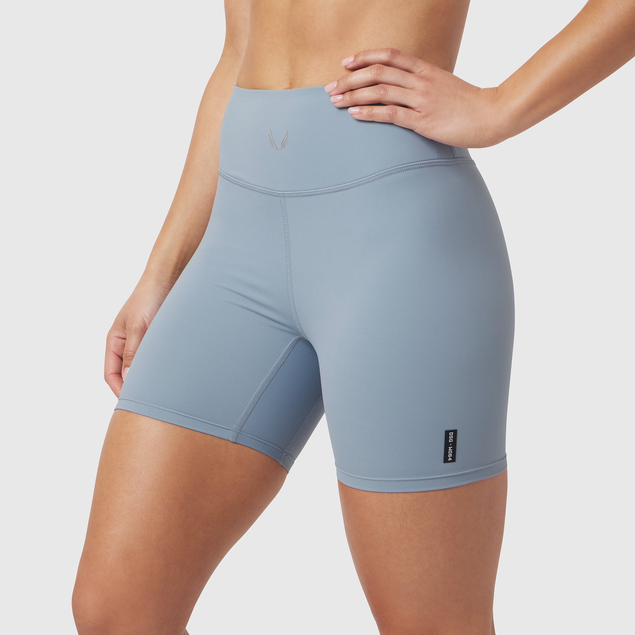 W064 LYCRA® ADAPTIV Biker Short in Light Sky, modeled on person