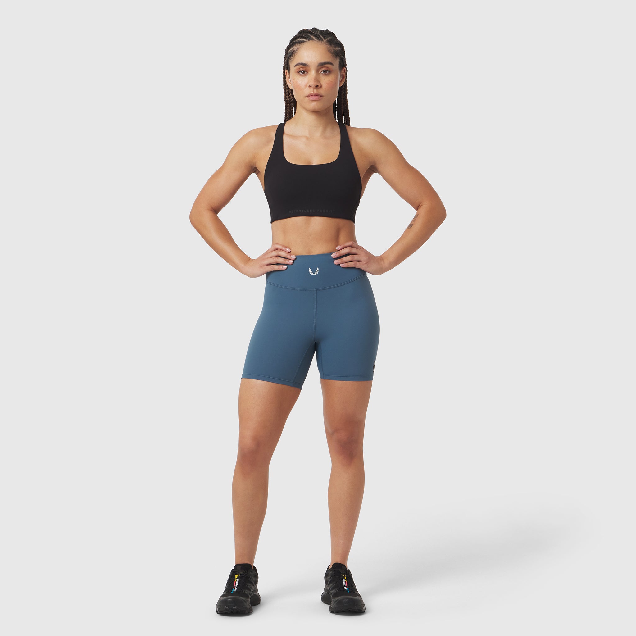 W064 LYCRA® ADAPTIV Biker Short in Storm blue, worn by model in athletic pose