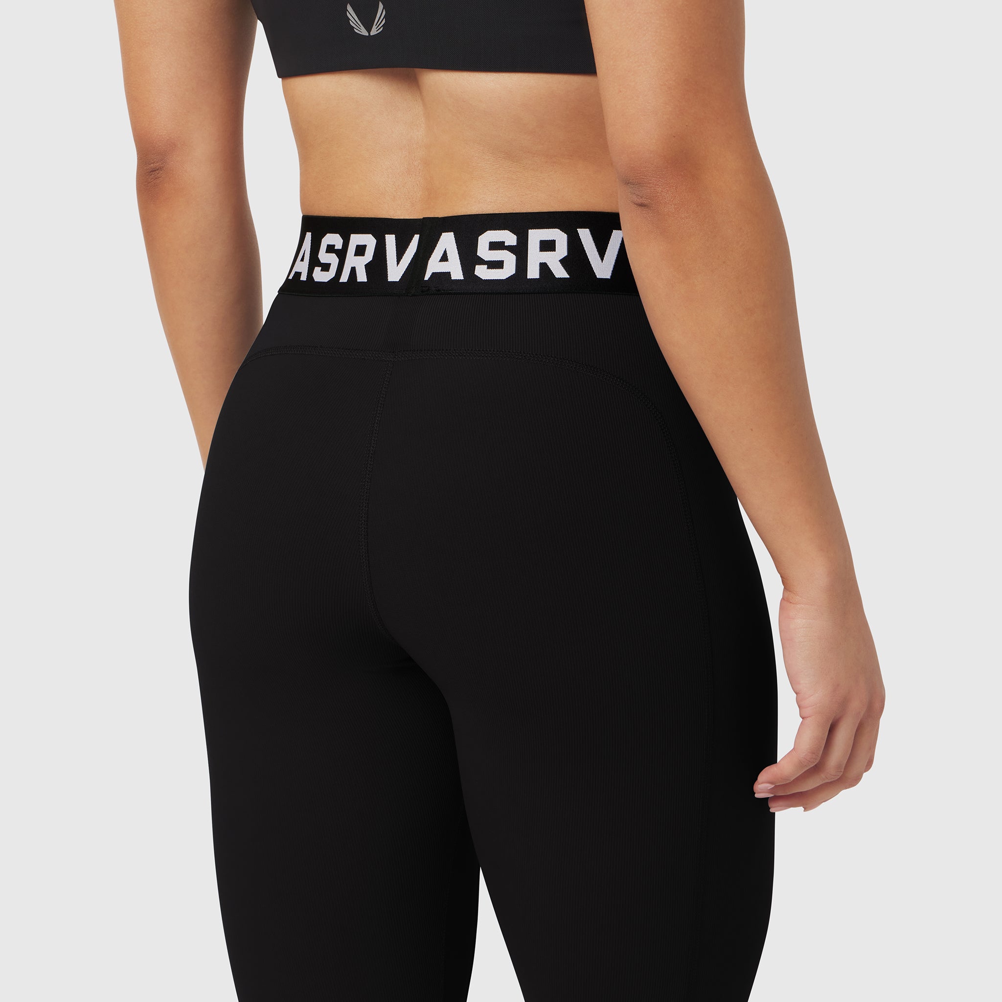 W071 Lycra Ribbed Legging in black, worn by model from waist down, back view