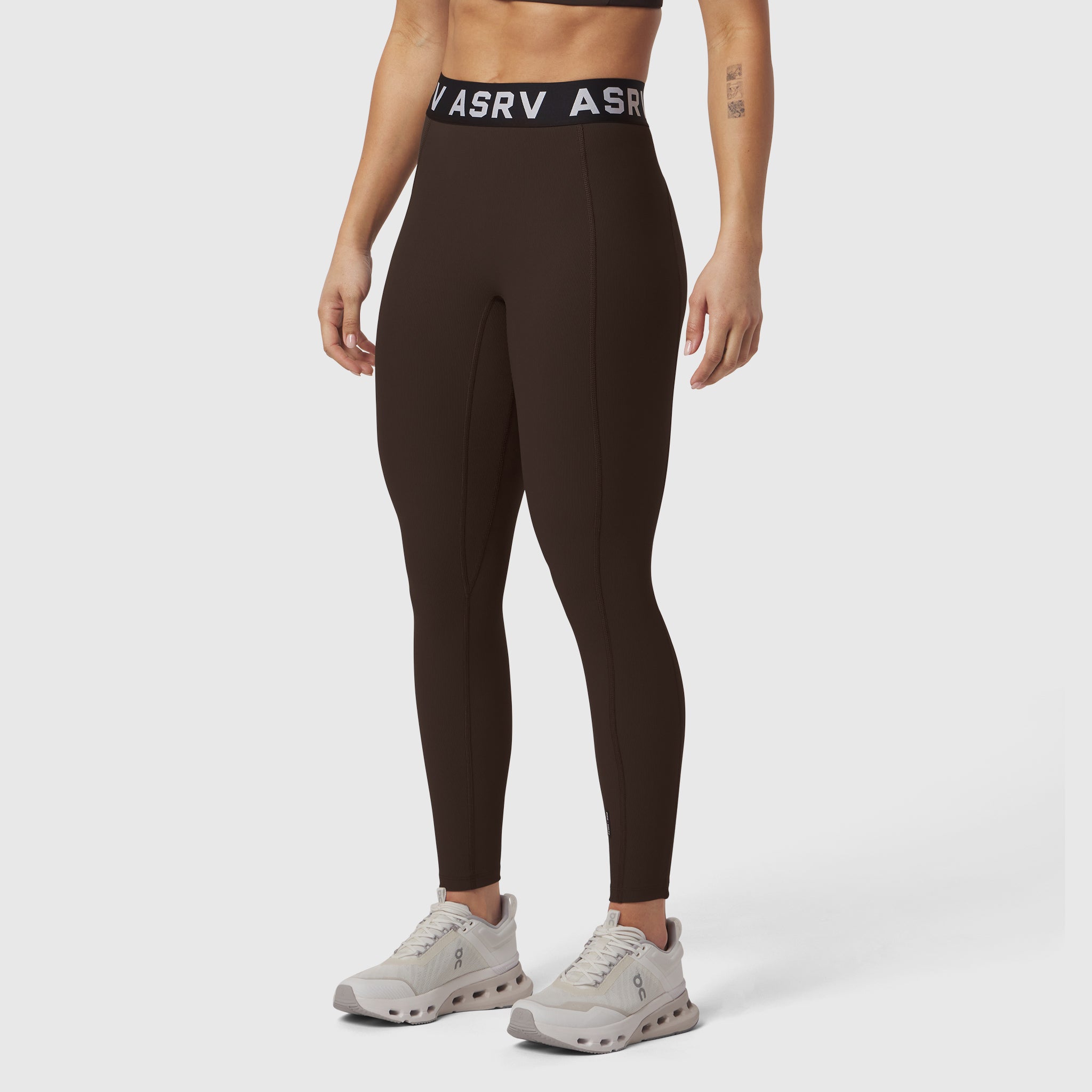 W071 Lycra Ribbed Legging in dark earth, worn by model with white sneakers, front view