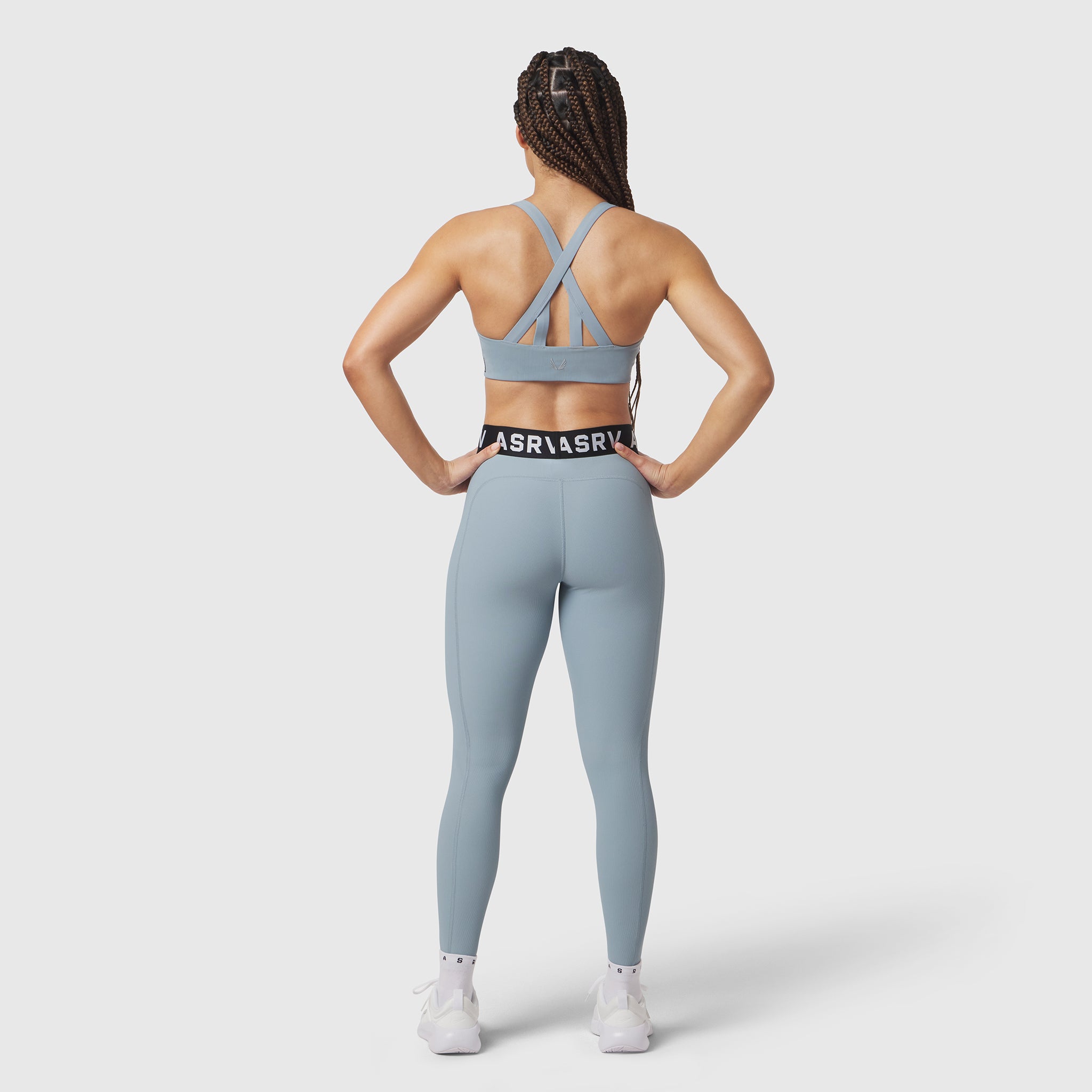 W071 Lycra Ribbed Legging in light sky, worn by model from behind, sports bra visible