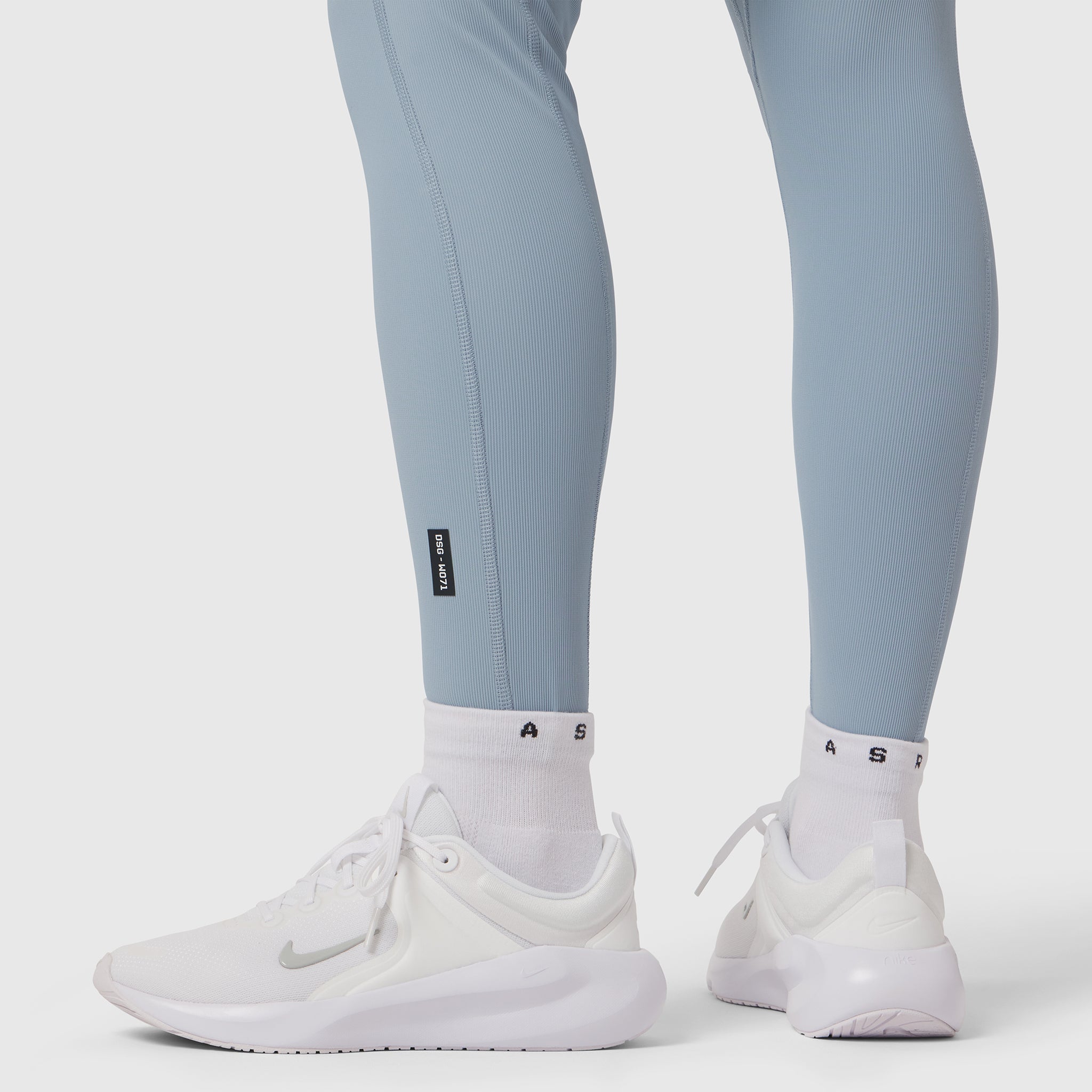 W071 Lycra Ribbed Legging in light sky worn with white socks and sneakers, lower body view