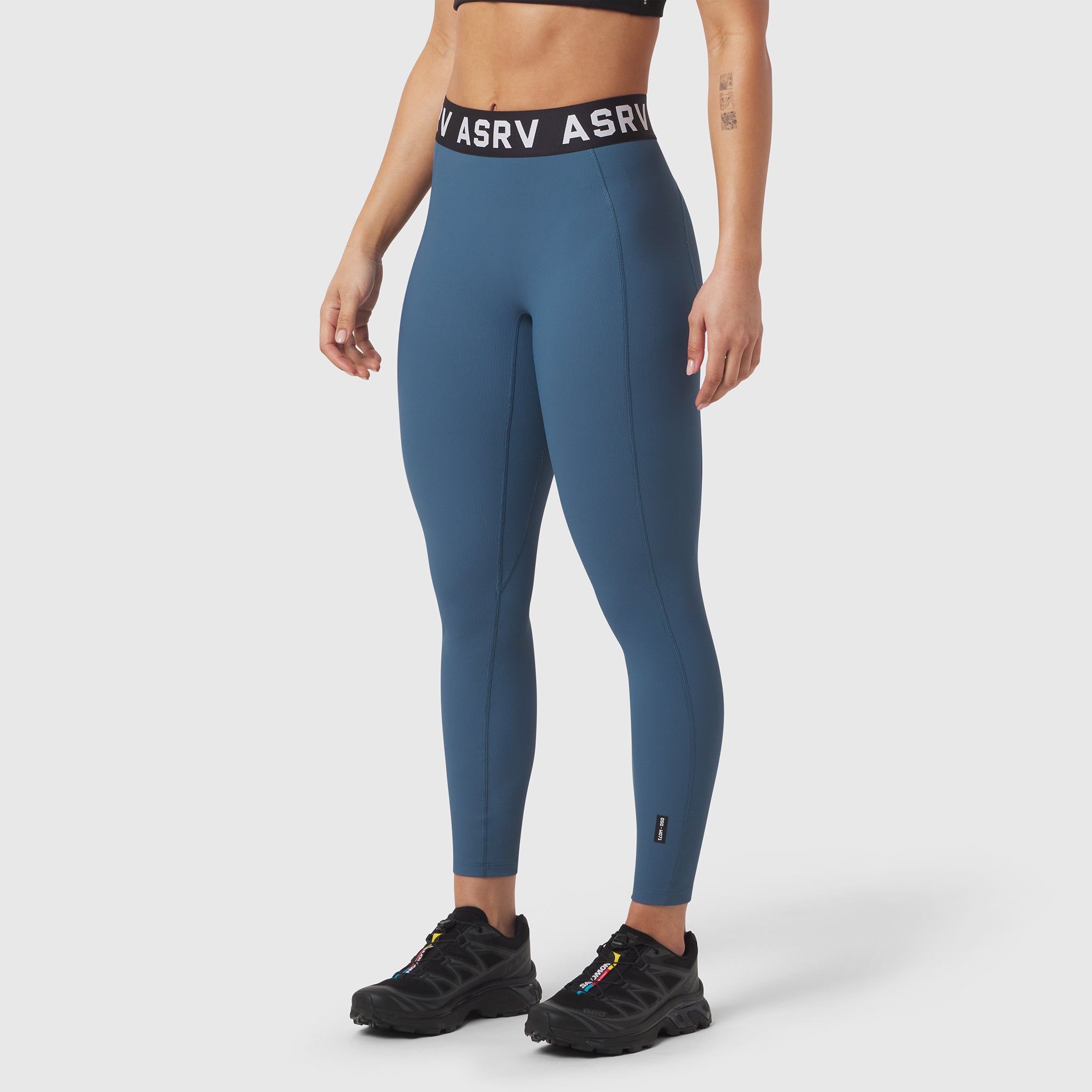 W071 Lycra Ribbed Legging in storm blue, worn by model with black sneakers