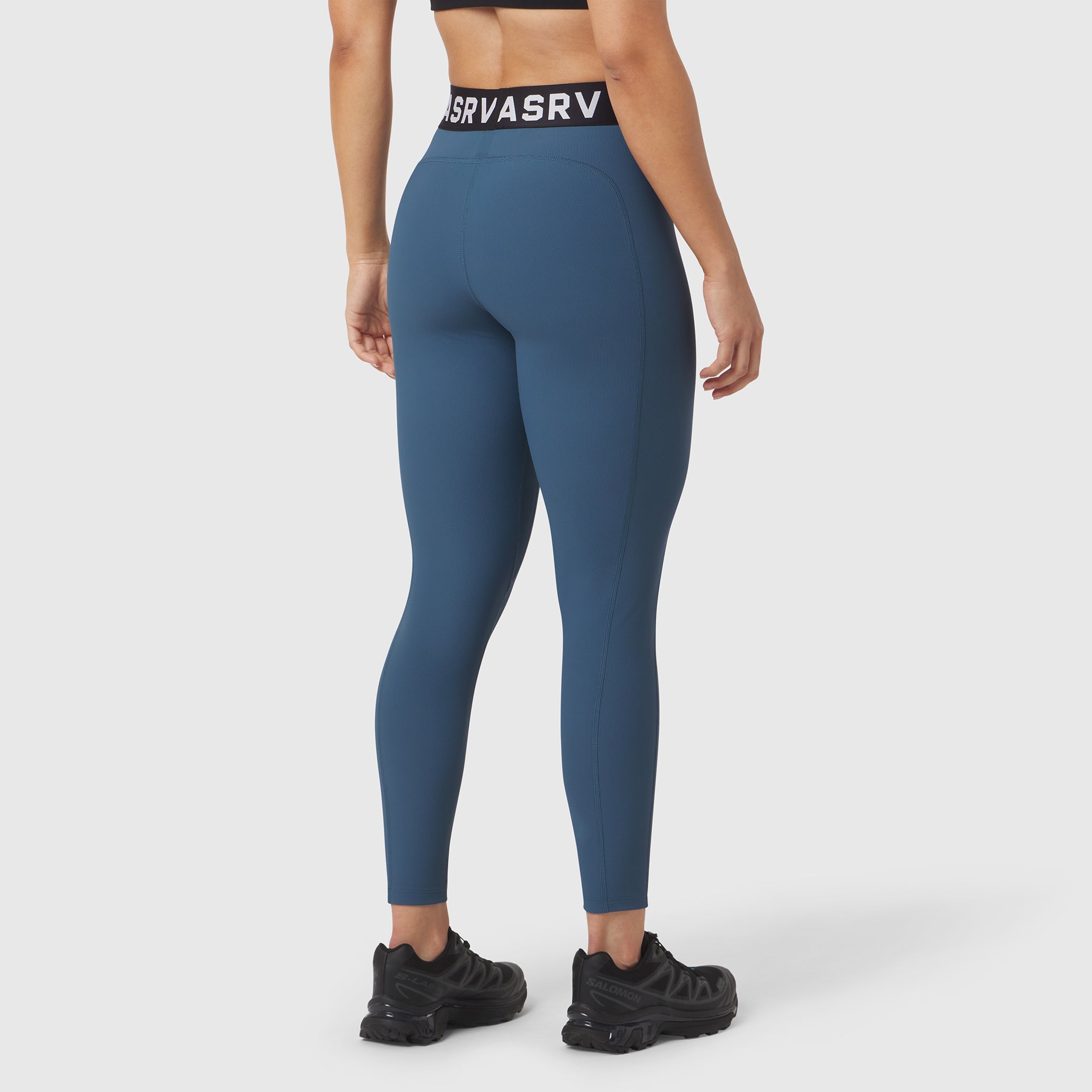 W071 LYCRA® Ribbed Legging in storm blue, rear view on model with black sneakers