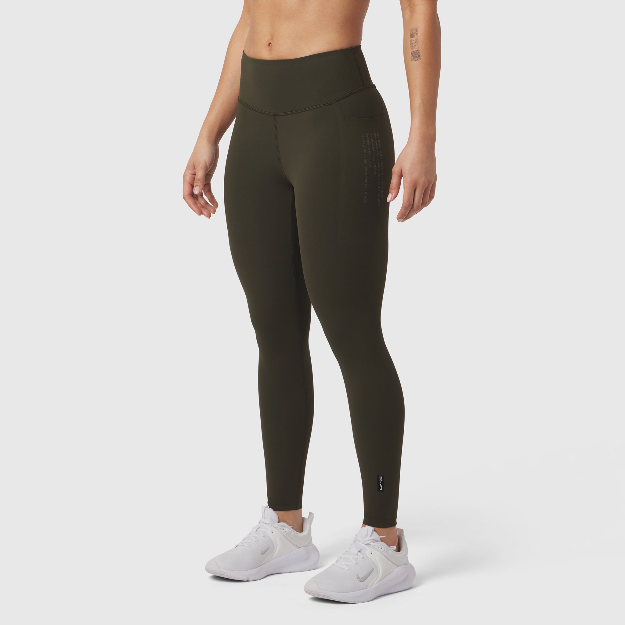 W072 LYCRA® ADAPTIV 4 Pocket Legging in olive, modeled with white sneakers