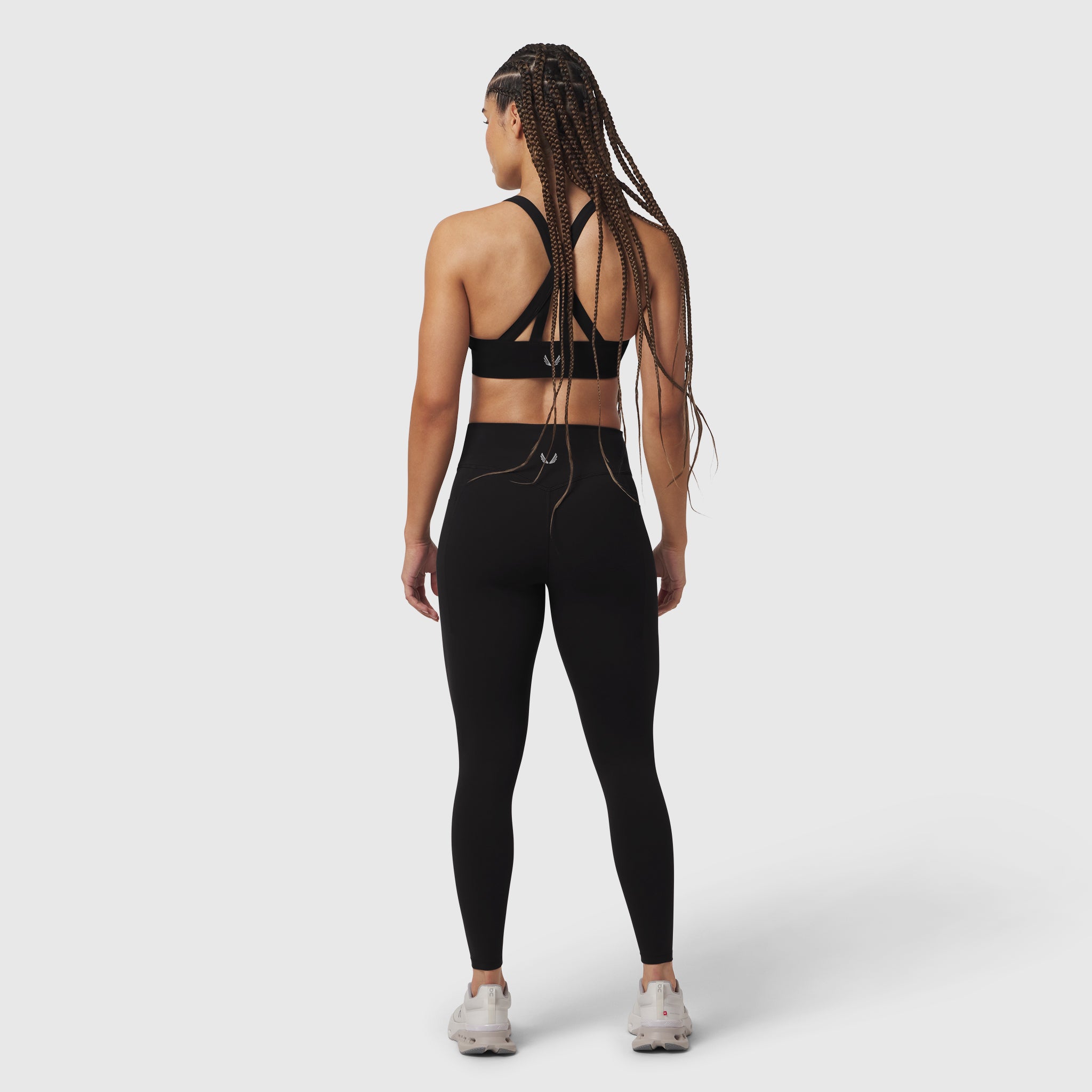 Black LYCRA® ADAPTIV 4 Pocket Legging worn by model, back view