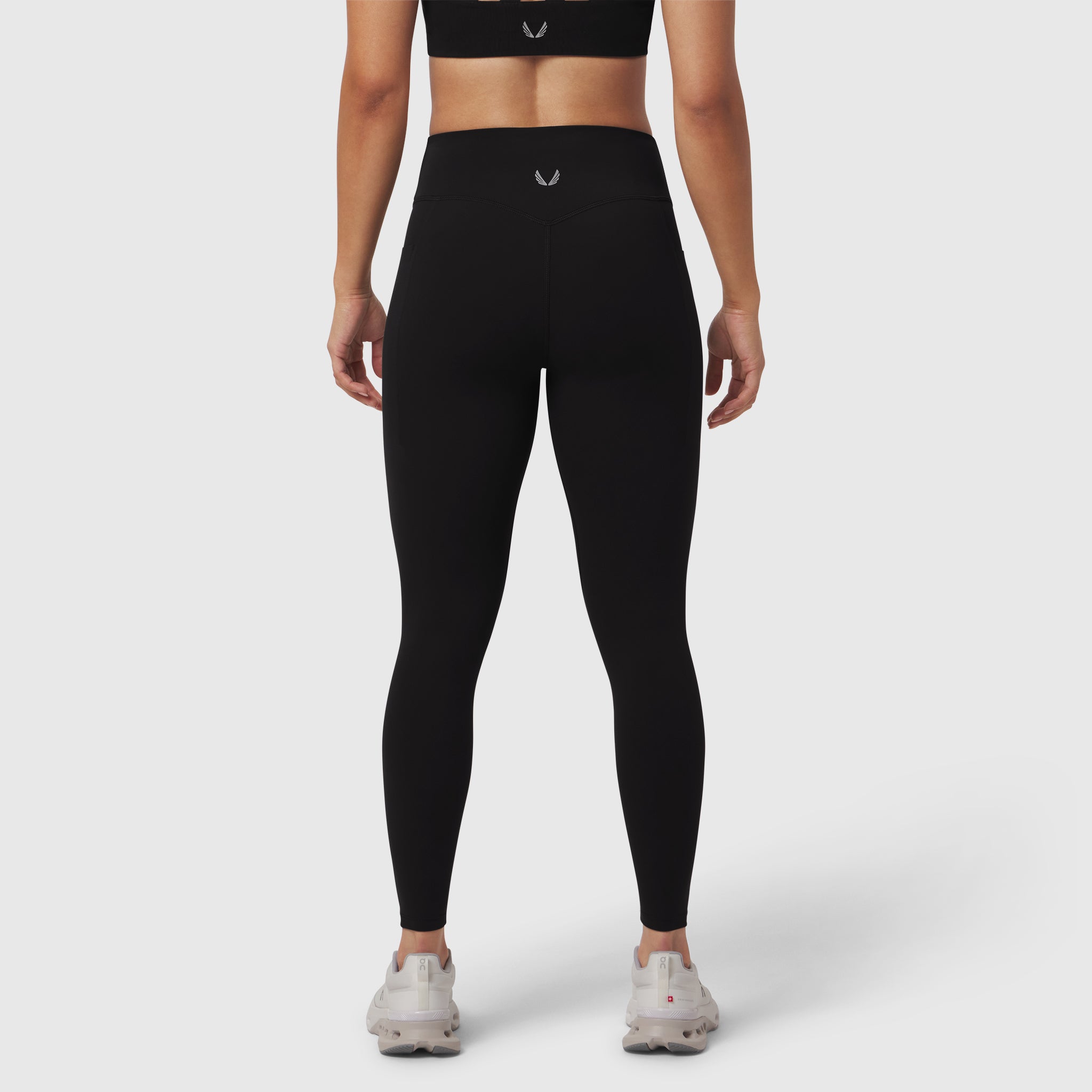 Black LYCRA® ADAPTIV 4 Pocket Legging worn by model, back view