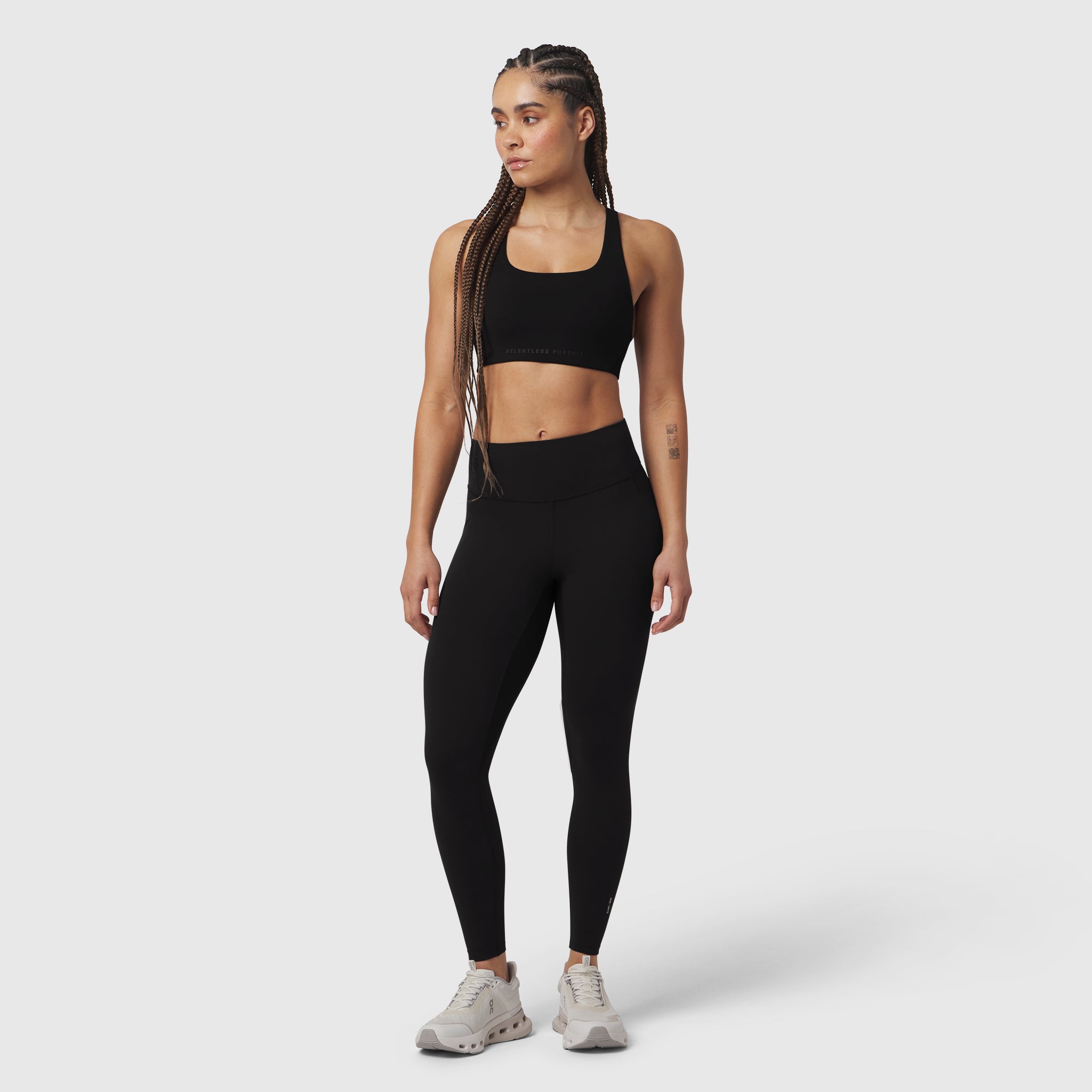 Black LYCRA® ADAPTIV 4 Pocket Legging worn with sports bra, front view