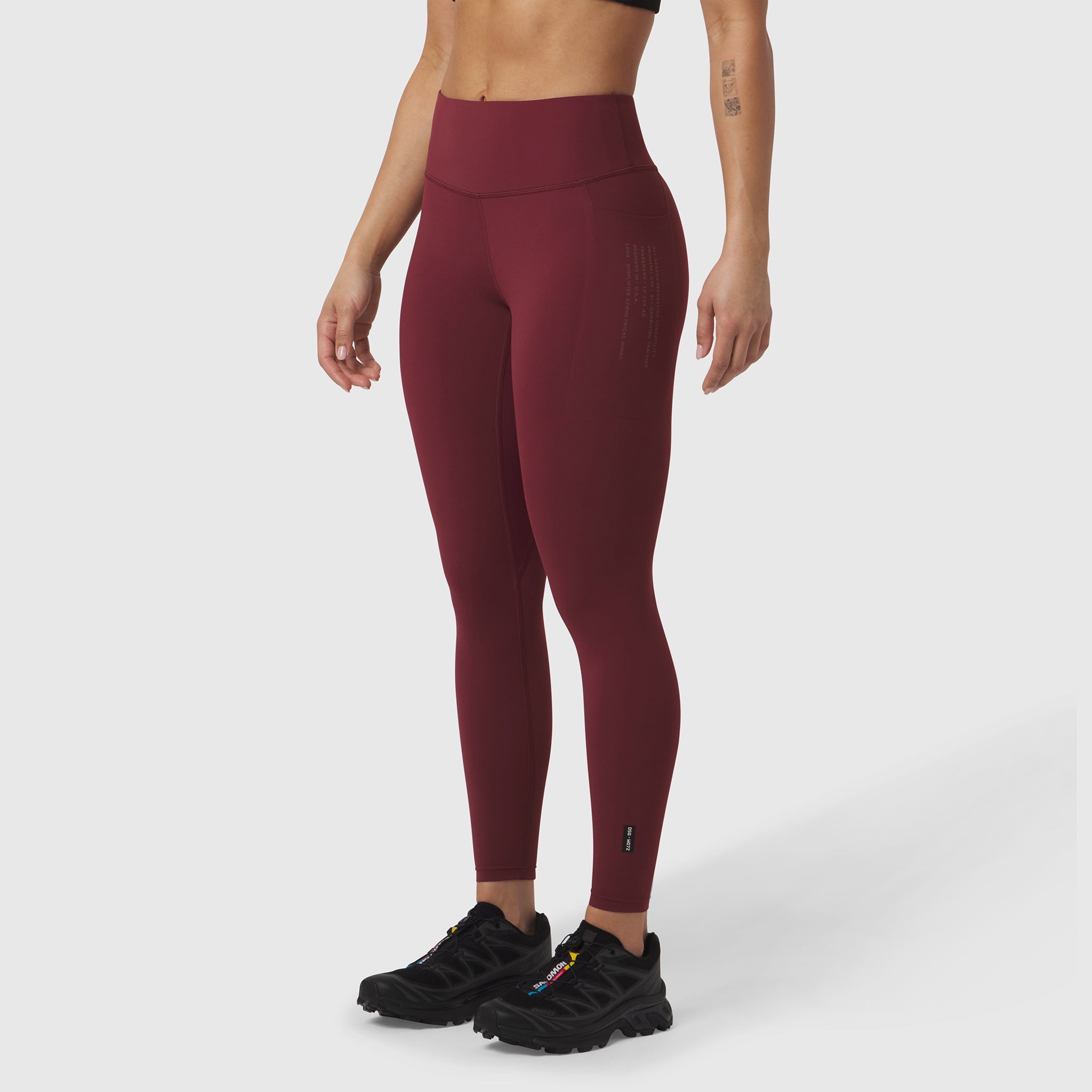 W072 Lycra Adaptiv 4 Pocket Legging in crimson, modeled from front side view
