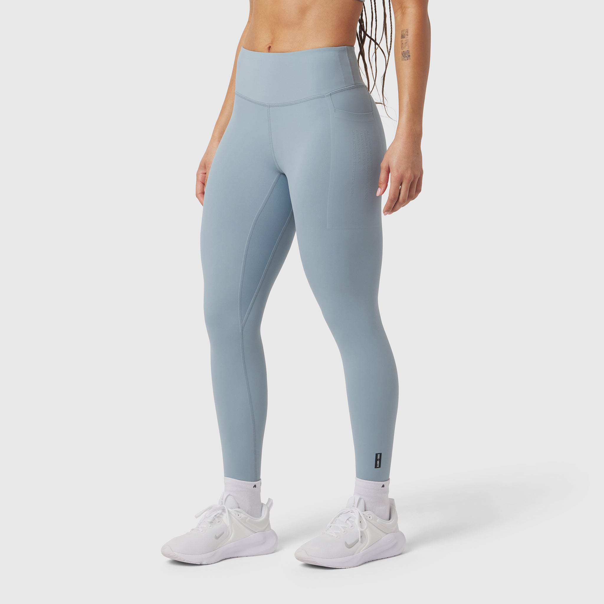 W072 LYCRA® ADAPTIV 4 Pocket Legging in light sky, worn with white sneakers, side view