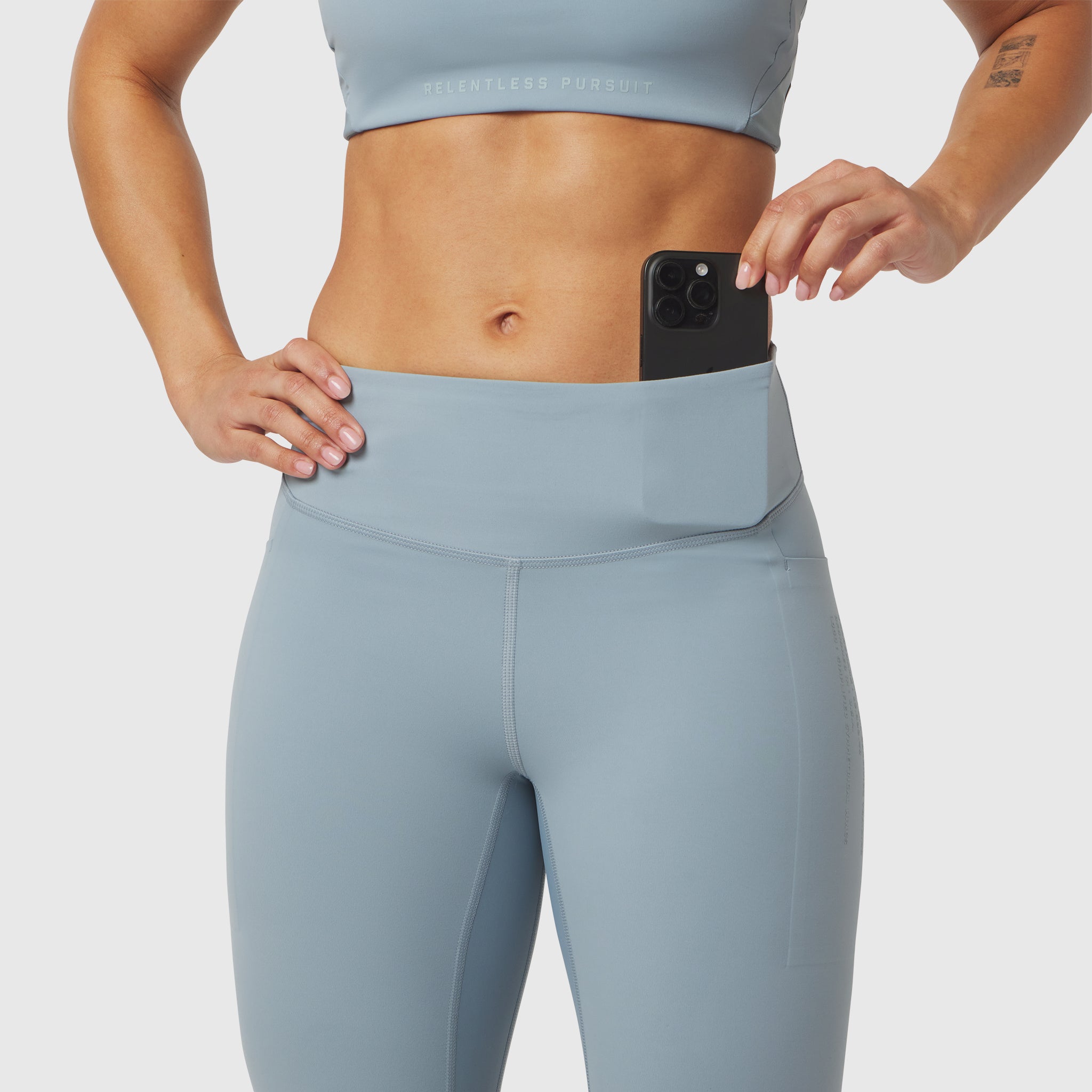 W072 Lycra Adaptiv 4 Pocket Legging in light sky, worn by model with phone in pocket
