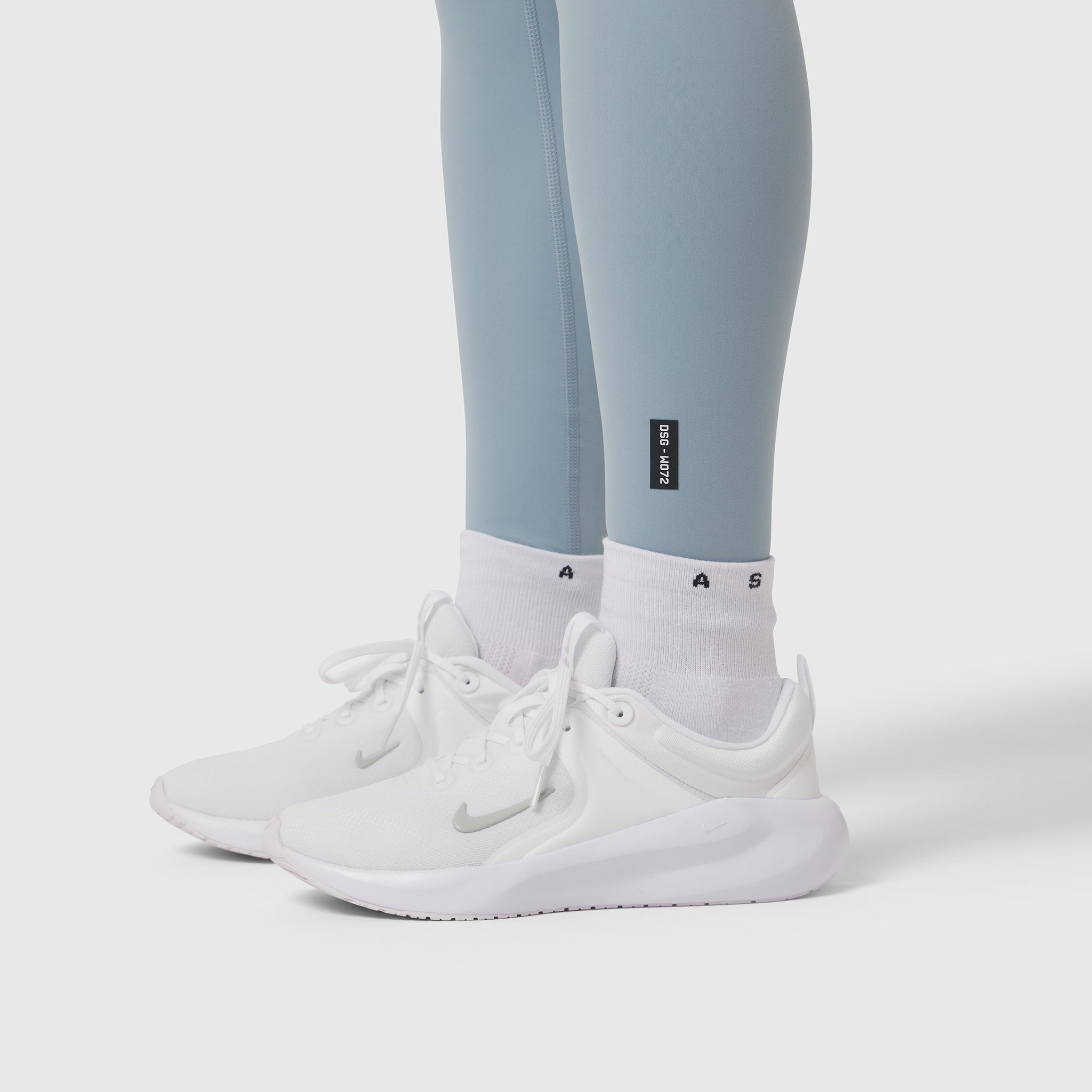 W072 LYCRA® ADAPTIV 4 Pocket Legging in light sky worn with white socks and sneakers, lower body view