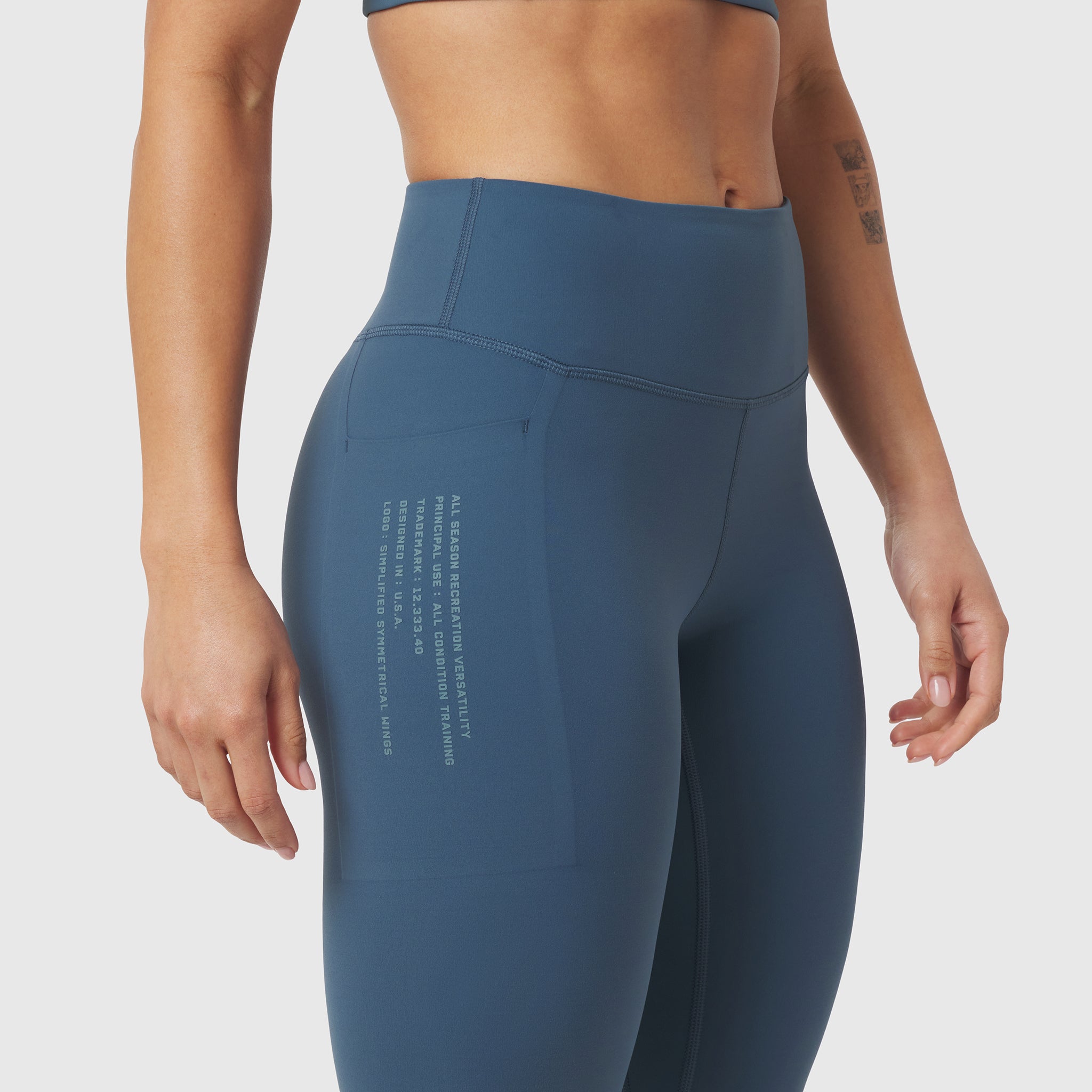 W072 LYCRA® ADAPTIV 4 Pocket Legging in storm blue, worn by model, side view