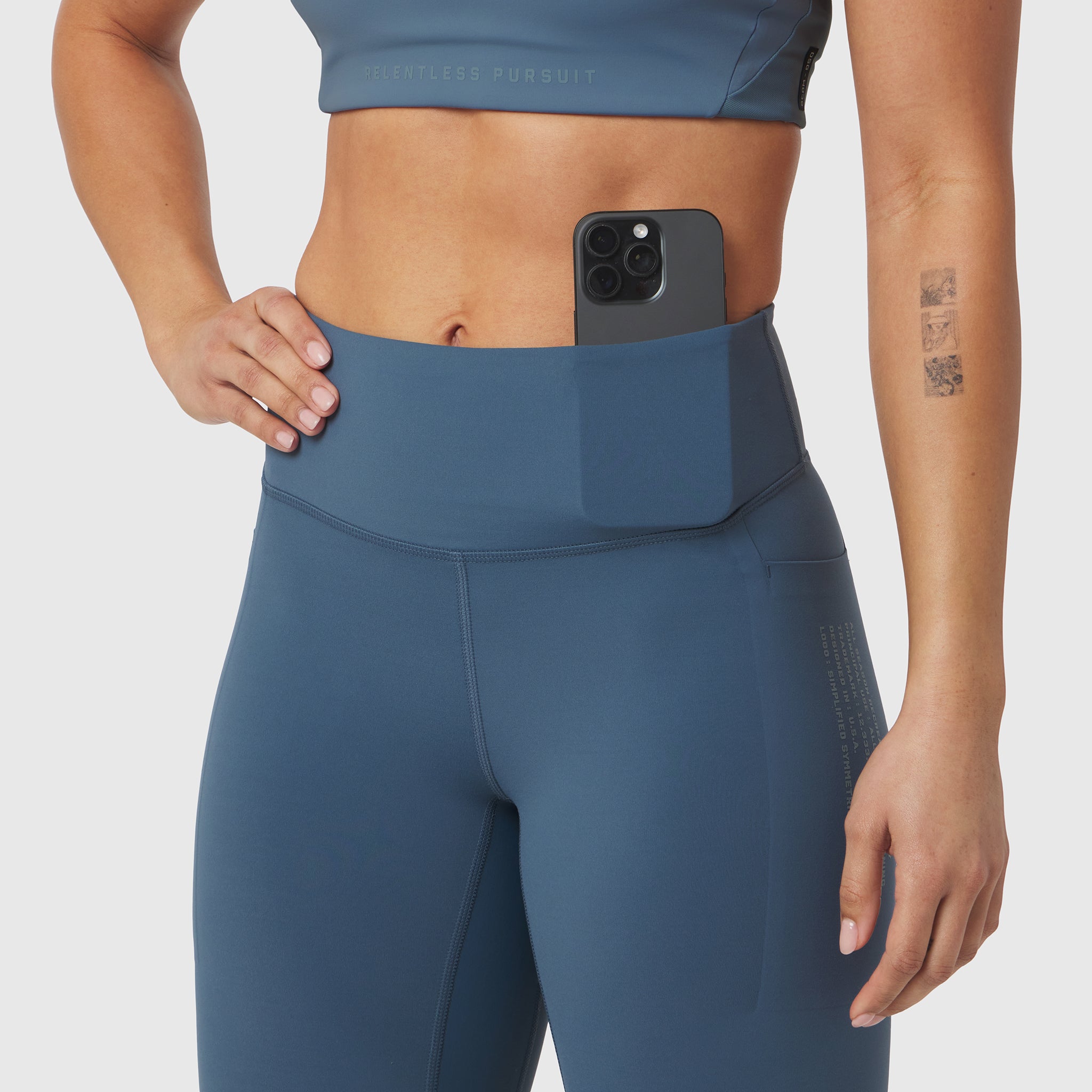 W072 LYCRA® ADAPTIV 4 Pocket Legging in Storm, worn by model showing waistband pocket detail