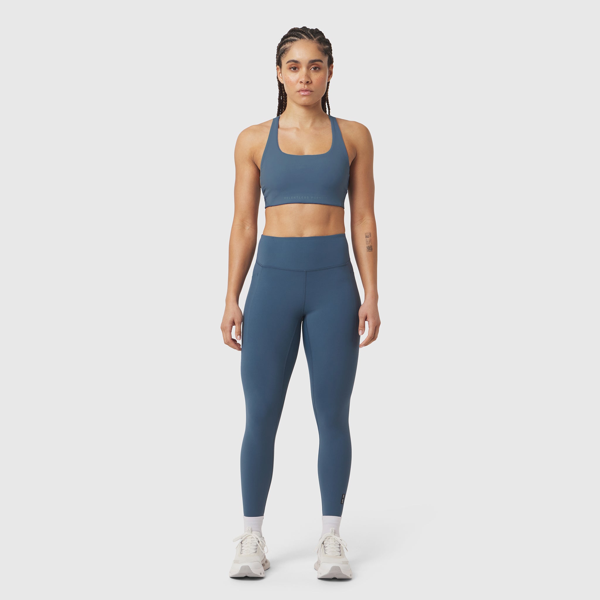 W072 LYCRA® ADAPTIV 4 Pocket Legging in storm blue, worn by model standing facing camera