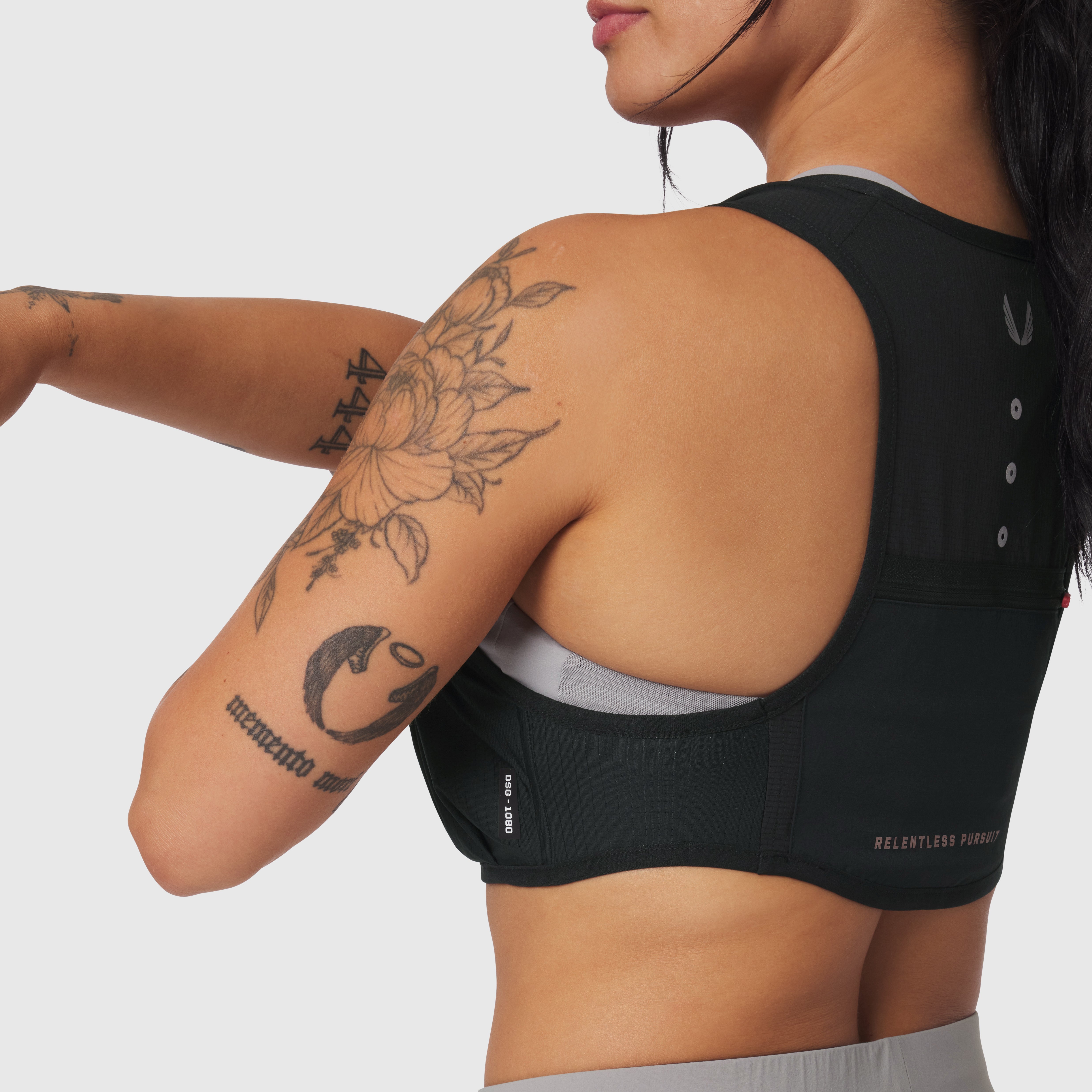 1080 Run Pack sports bra in black, back view on model