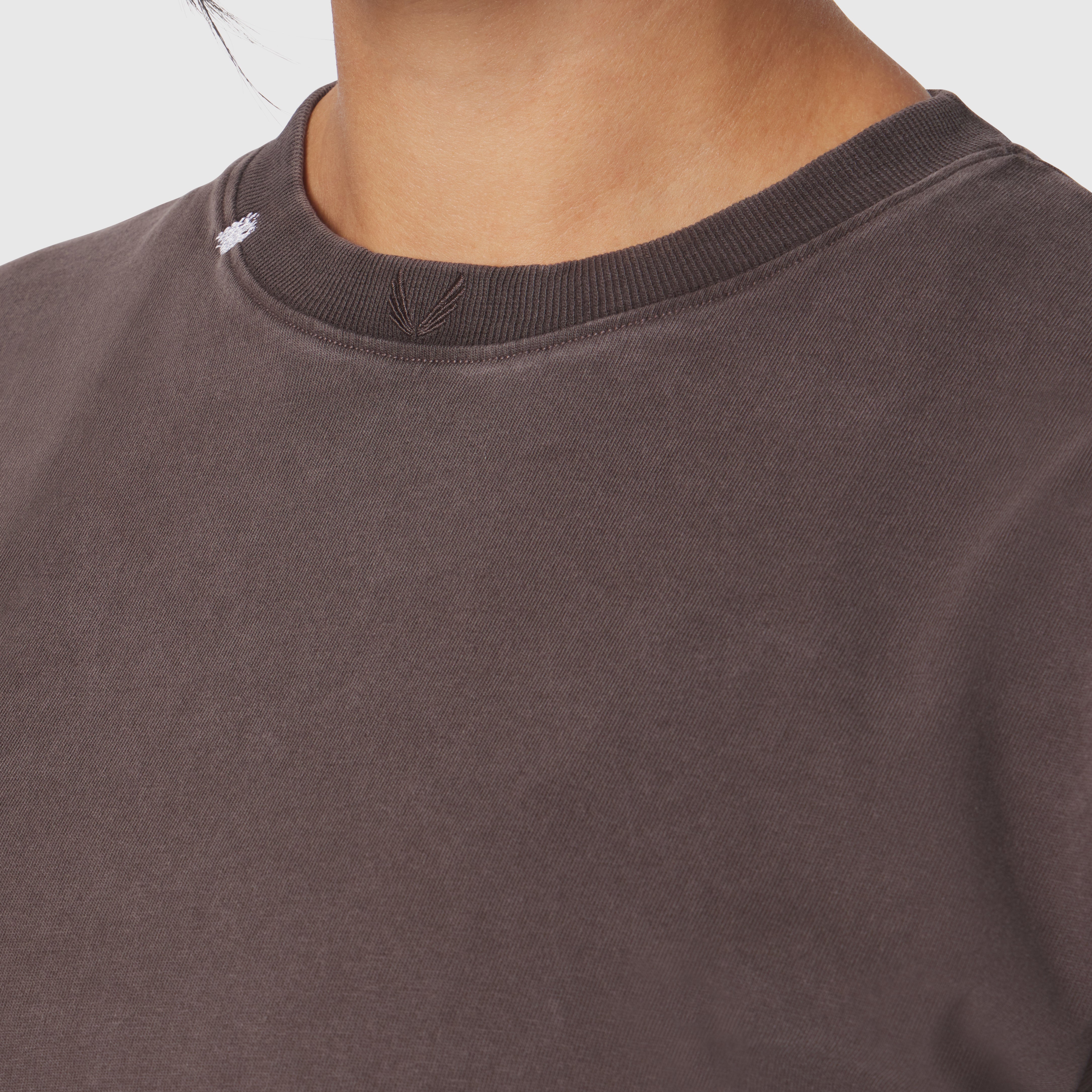 Distressed Relaxed Tee in Dark Earth worn by model, neckline detail view
