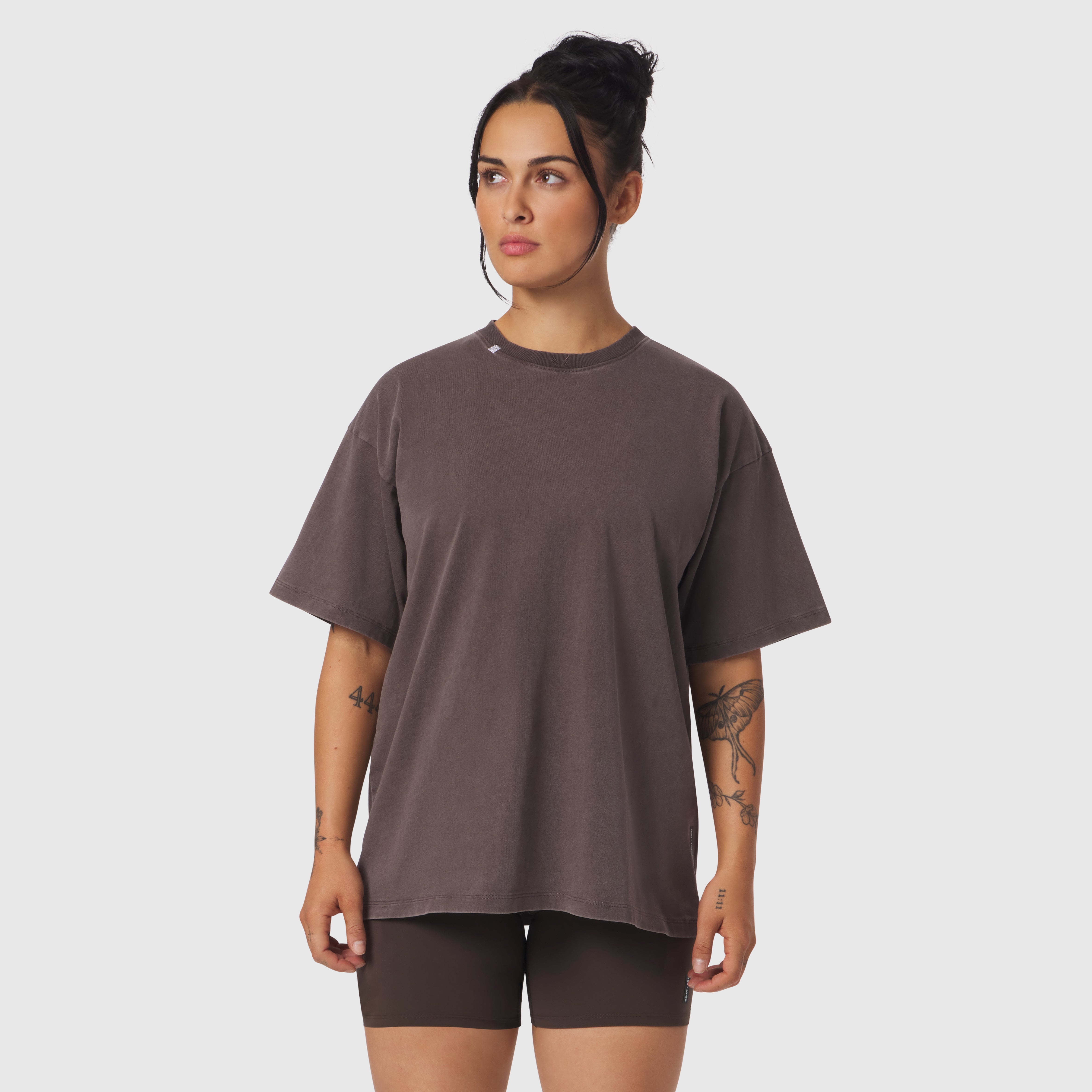 Distressed Relaxed Tee in Dark Earth, worn with black shorts, front view on model