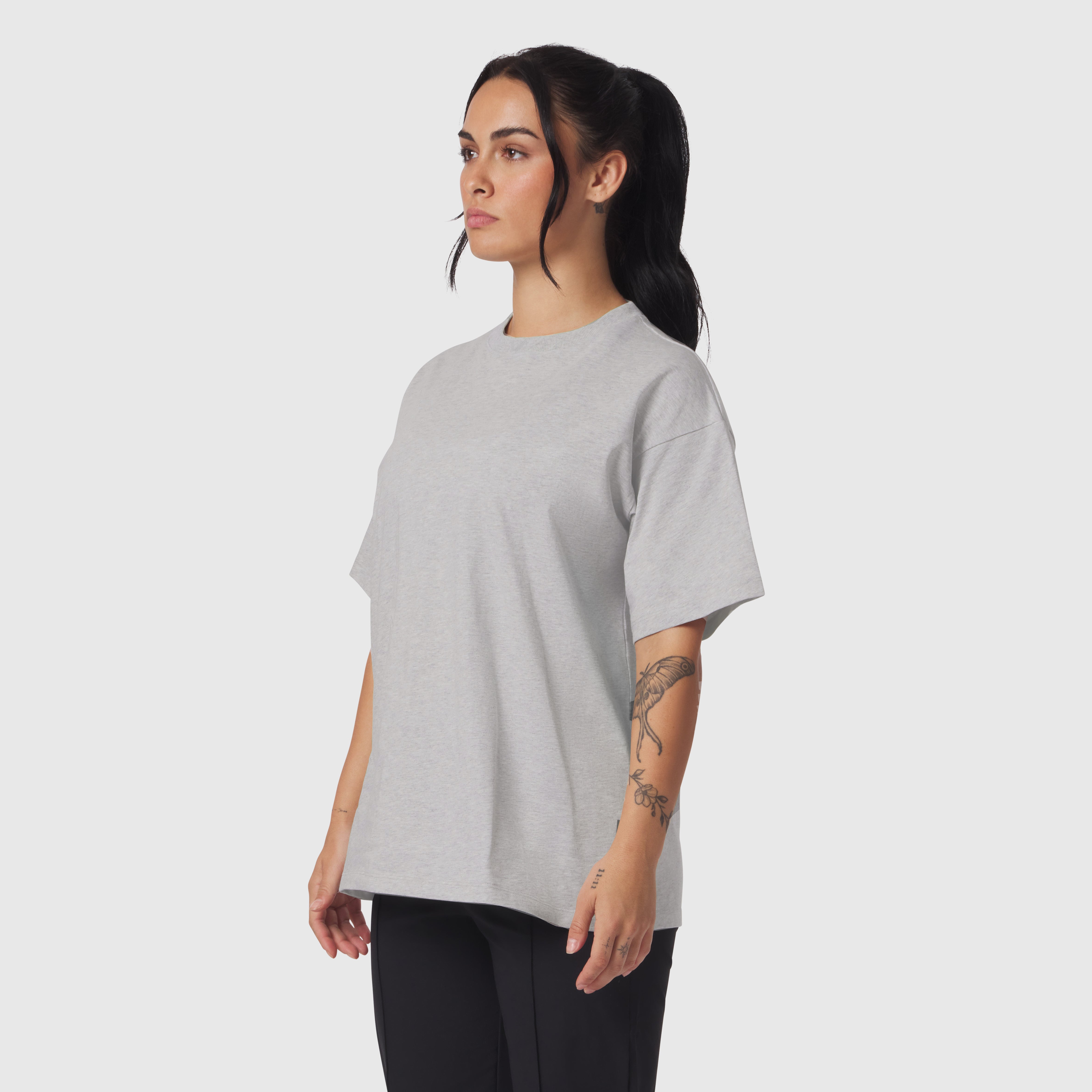 Distressed Relaxed Tee in Heather Grey worn by model, side profile view