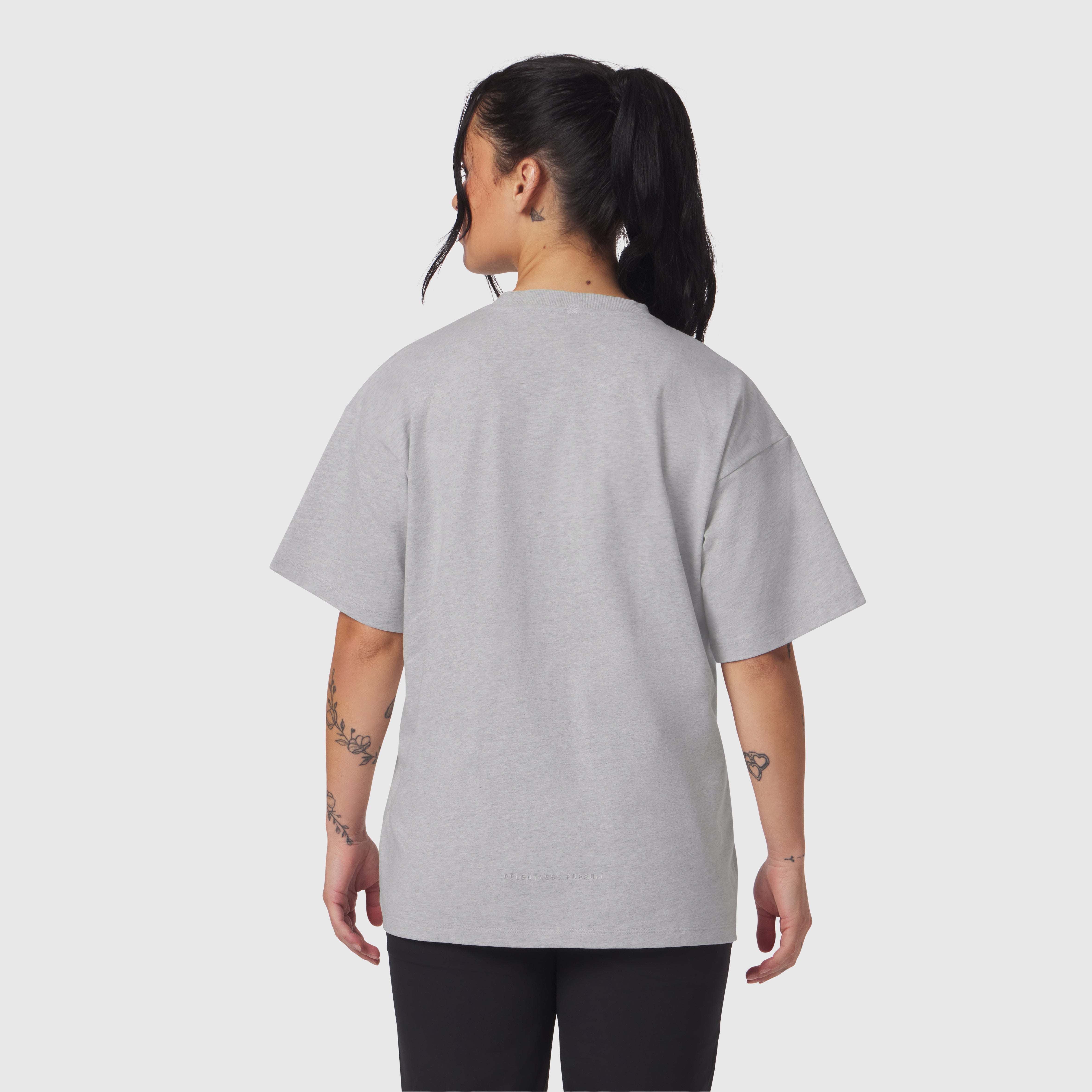 Distressed Relaxed Tee in heather grey, worn by model shown from back
