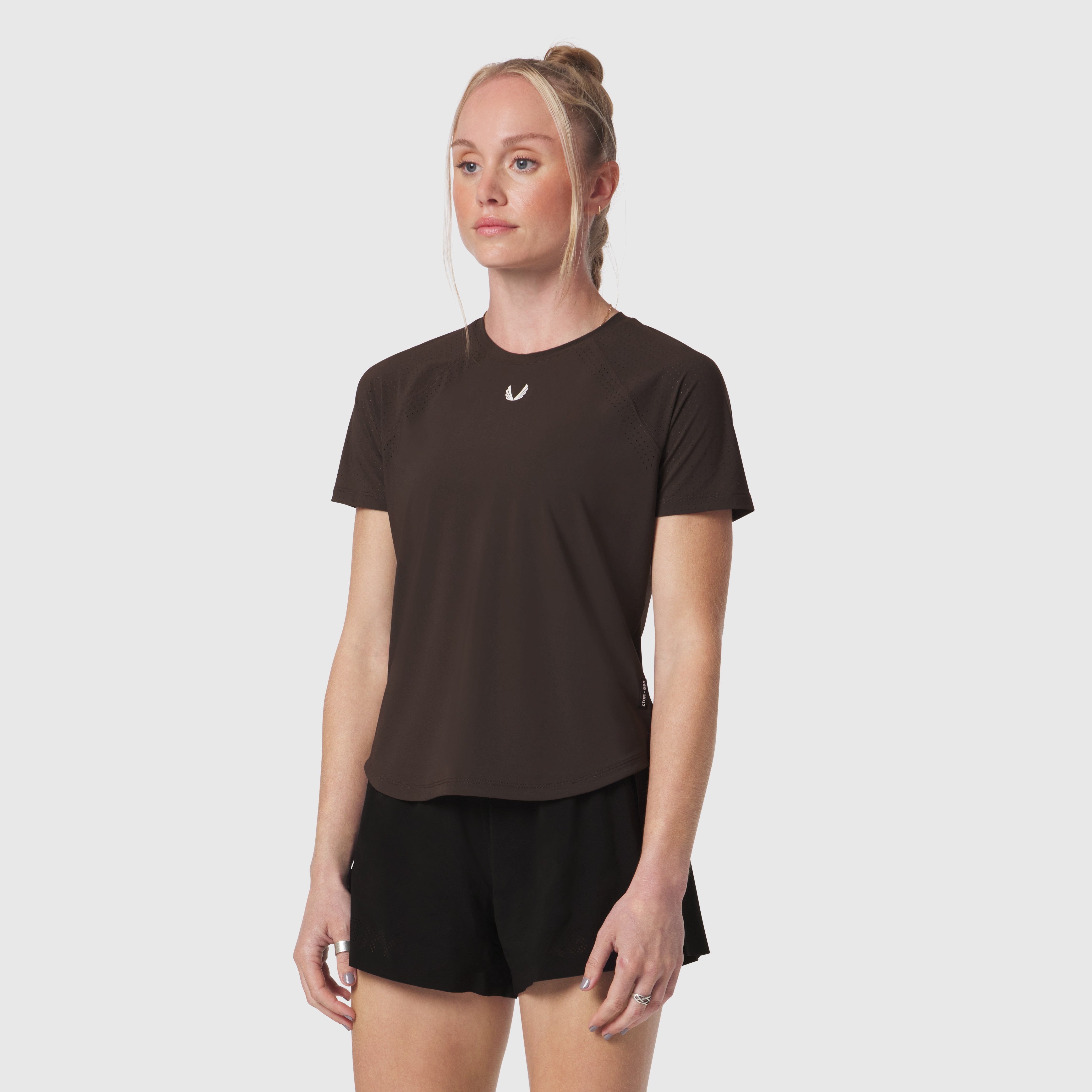 Laser-Vent Established Tee in dark earth worn by model with black shorts, front view